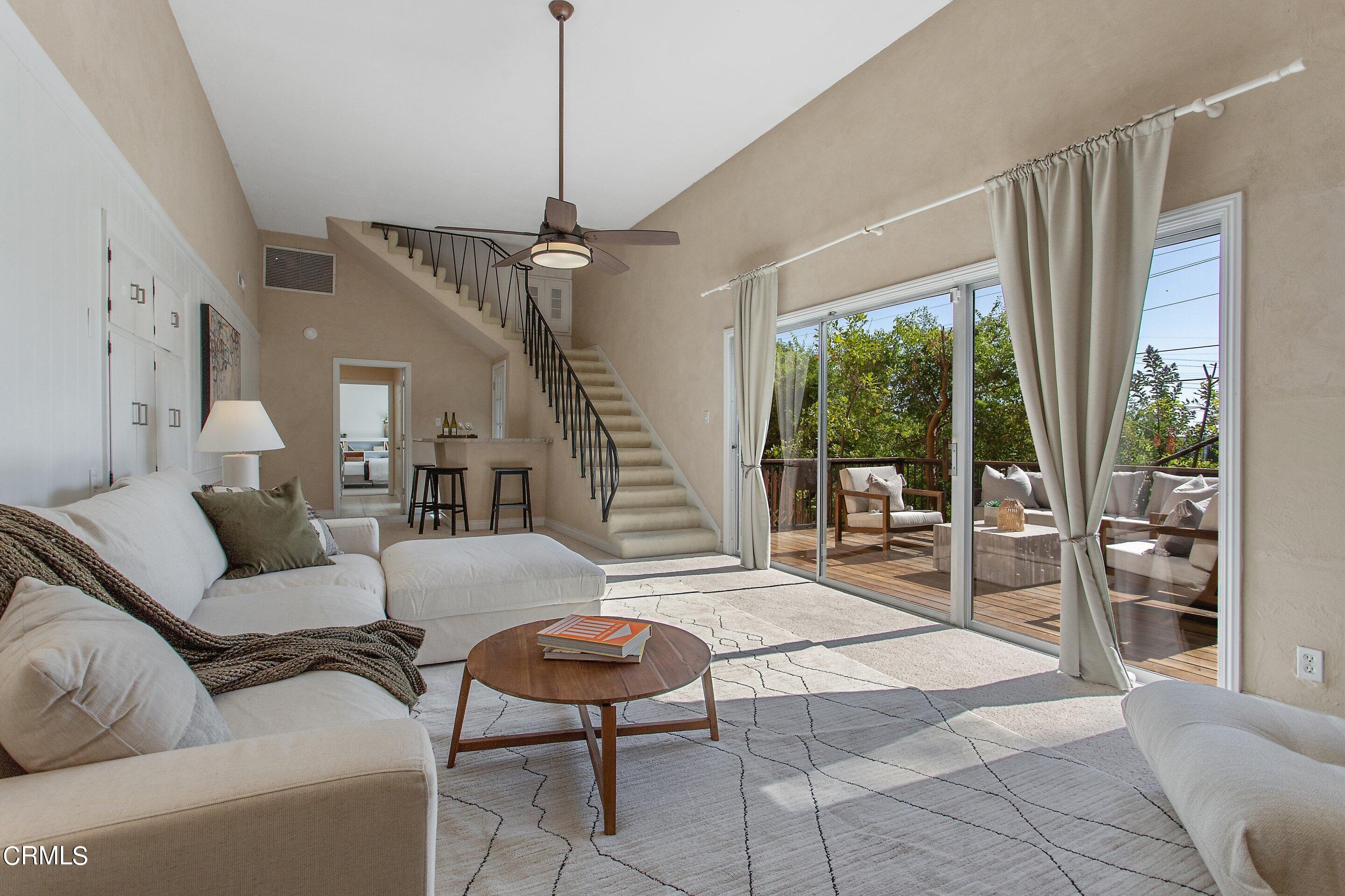 3170 Buckingham Road Glendale, CA 91206 - Photo 29 of 47 a living room with furniture and a floor to ceiling window