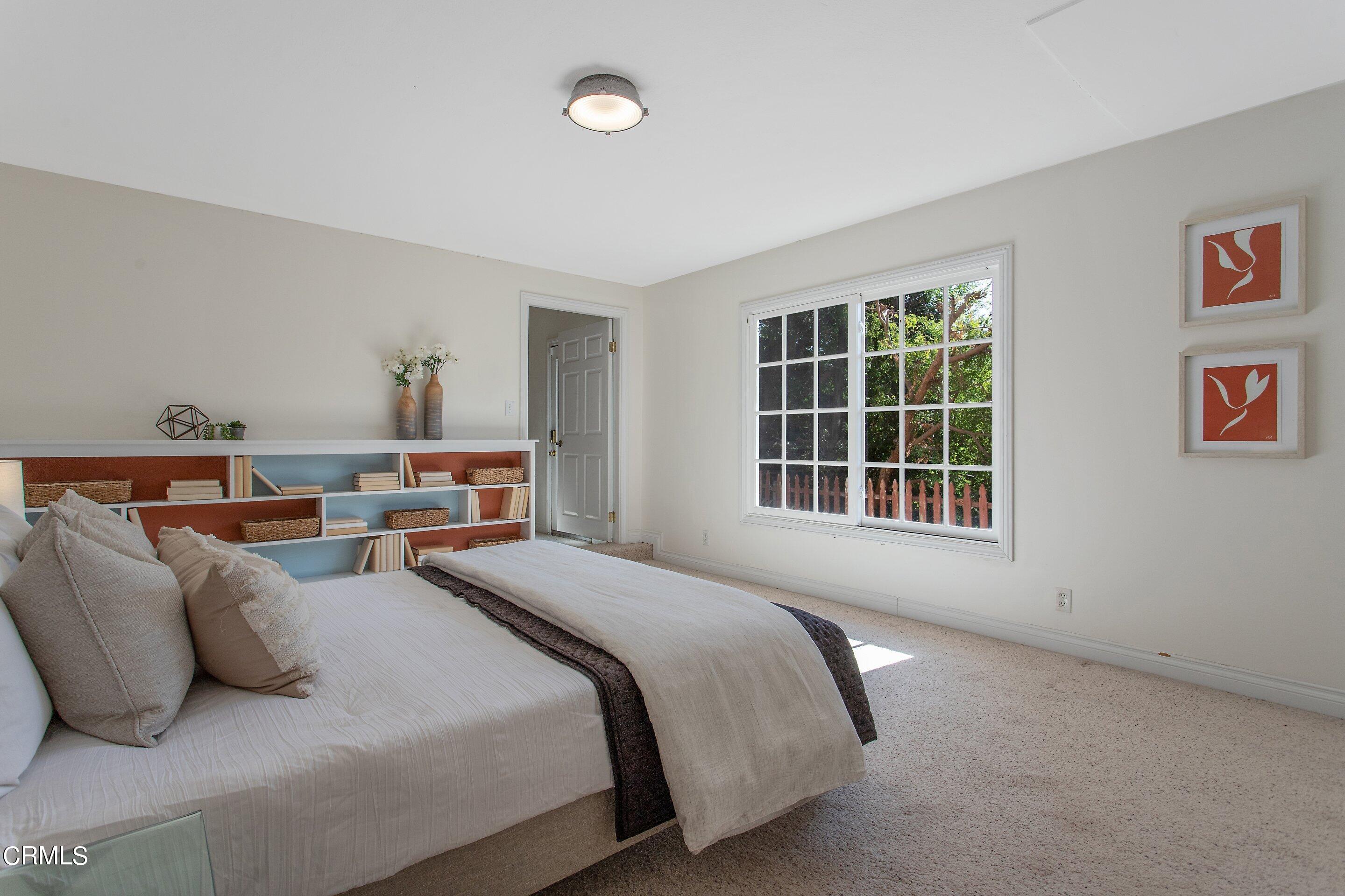 3170 Buckingham Road Glendale, CA 91206 - Photo 34 of 47 a bedroom with bed and a large window