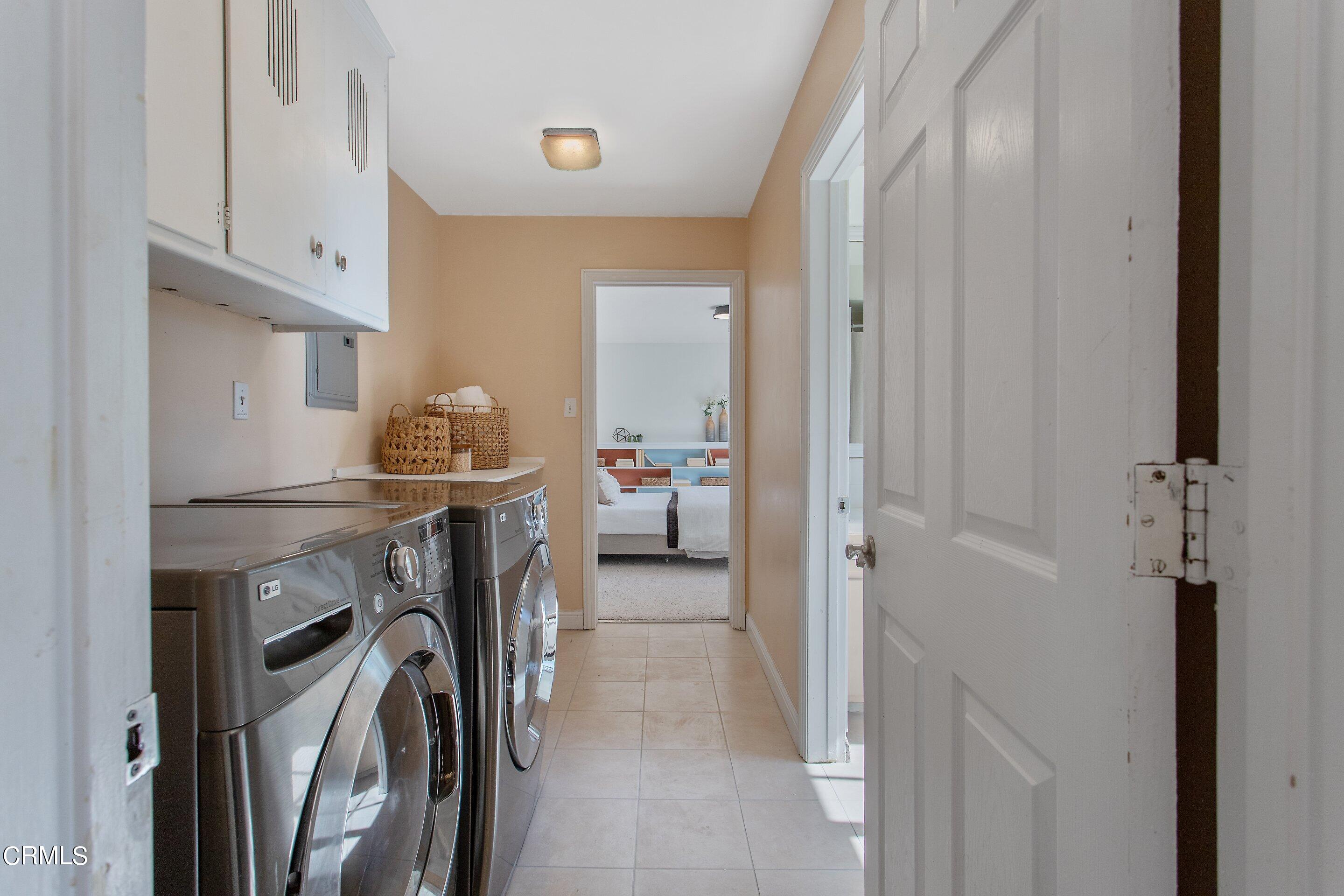 3170 Buckingham Road Glendale, CA 91206 - Photo 40 of 47 a utility room with cabinets washer and dryer