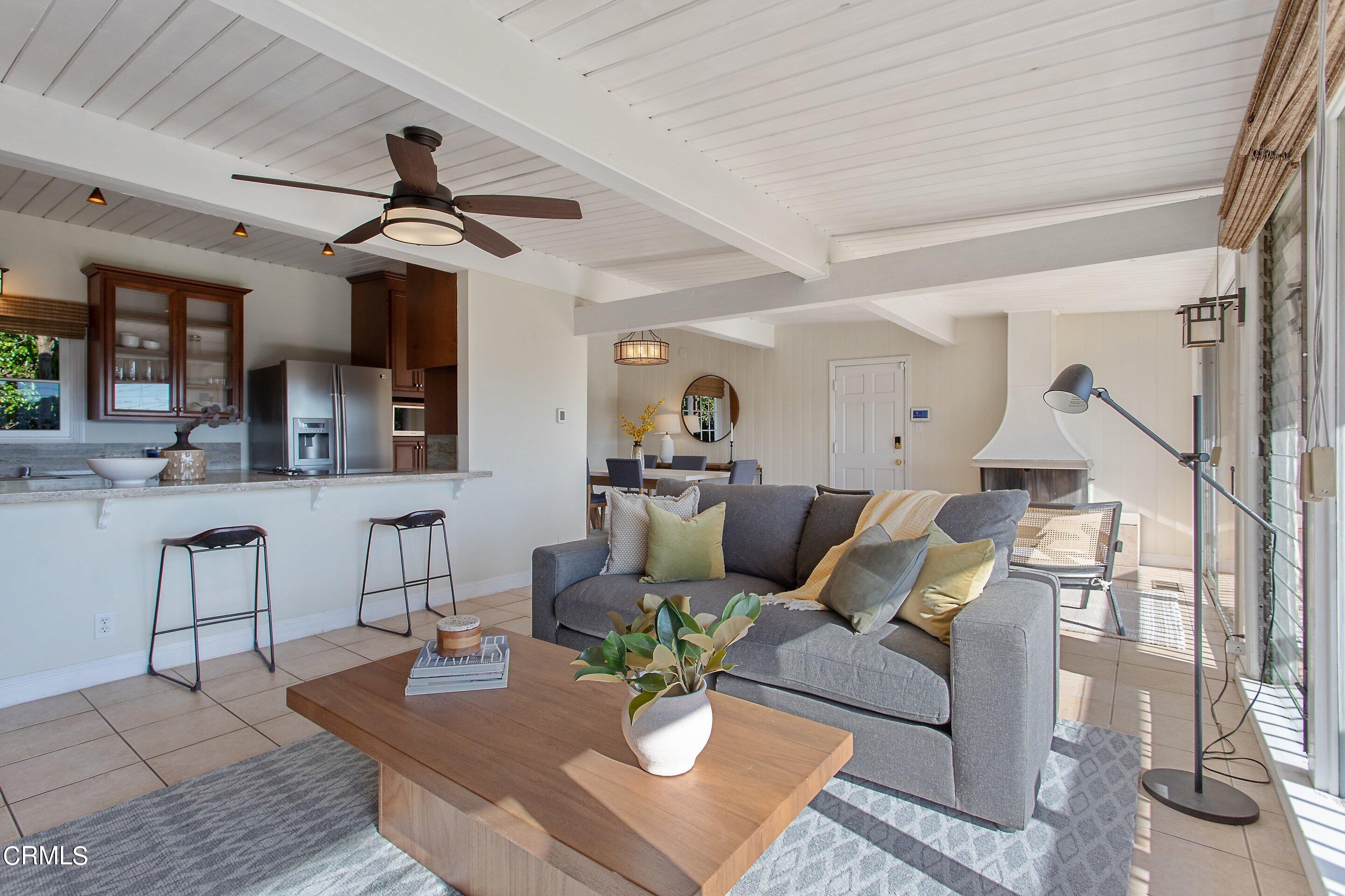 3170 Buckingham Road Glendale, CA 91206 - Photo 4 of 47 a living room with furniture a dining table and a chandelier