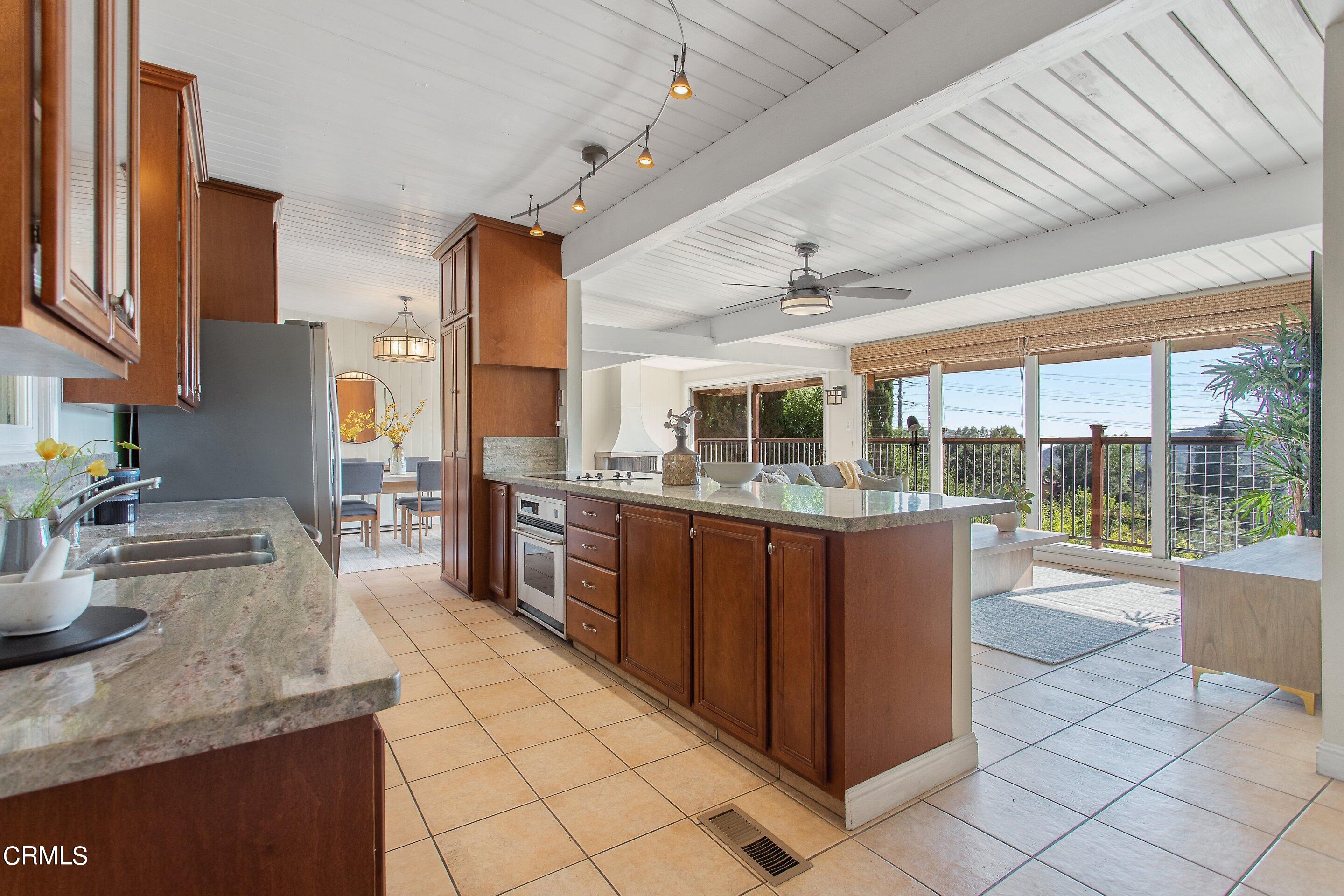 3170 Buckingham Road Glendale, CA 91206 - Photo 6 of 47 a kitchen with stainless steel appliances granite countertop a refrigerator and a stove