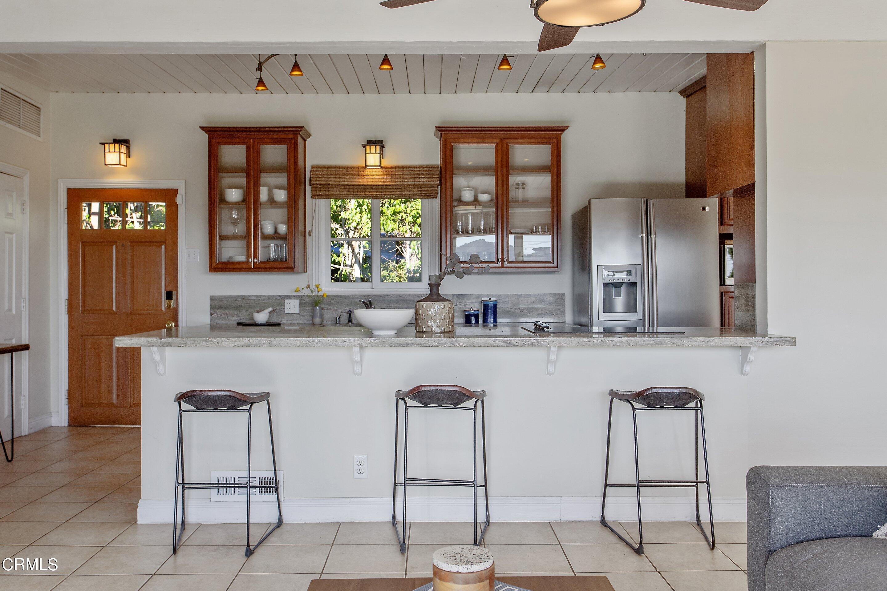 3170 Buckingham Road Glendale, CA 91206 - Photo 9 of 47 a kitchen with cabinets and chairs