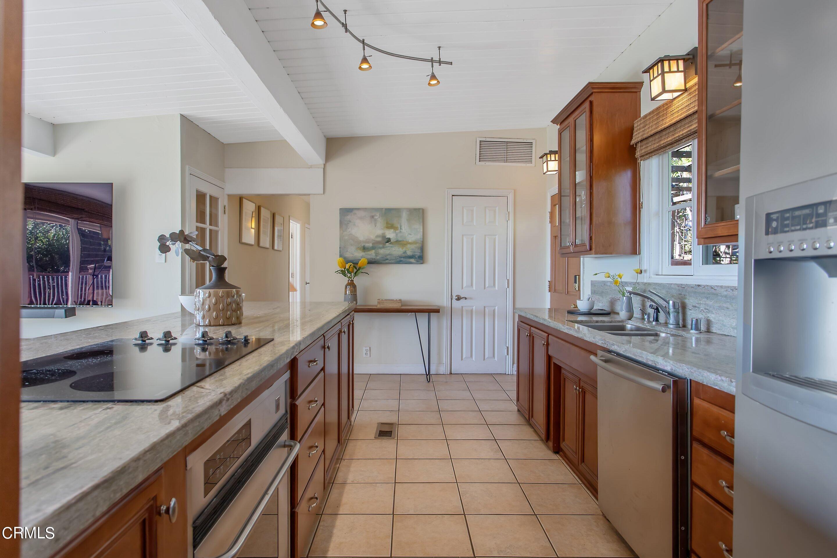 3170 Buckingham Road Glendale, CA 91206 - Photo 10 of 47 a kitchen with stainless steel appliances granite countertop a sink and cabinets