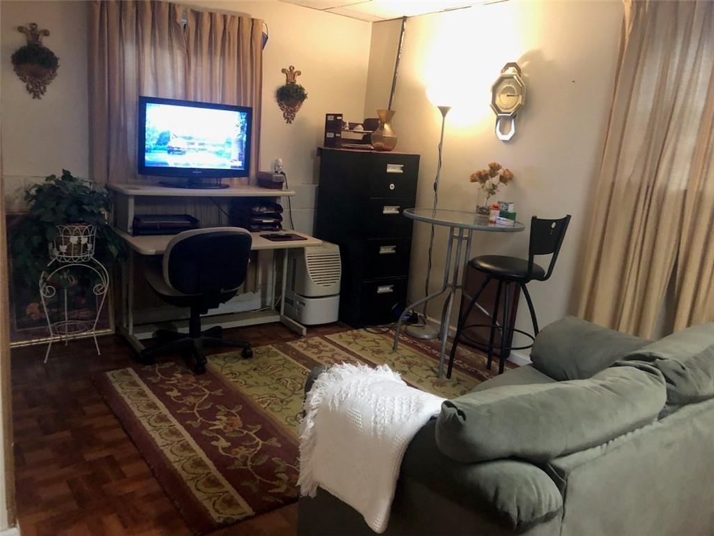 3960 Emerald N Drive Decatur, GA 30035 - Photo 2 of 8 a living room with furniture a flat screen tv and a fireplace
