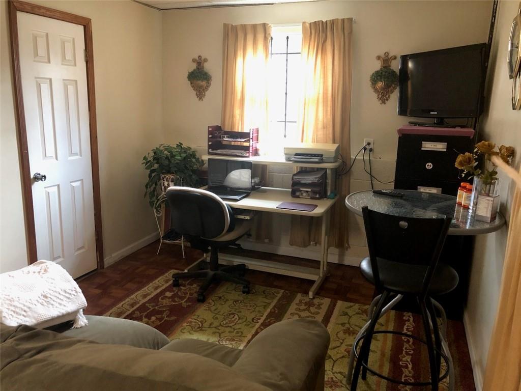 3960 Emerald N Drive Decatur, GA 30035 - Photo 3 of 8 a bedroom with a bed and a tv