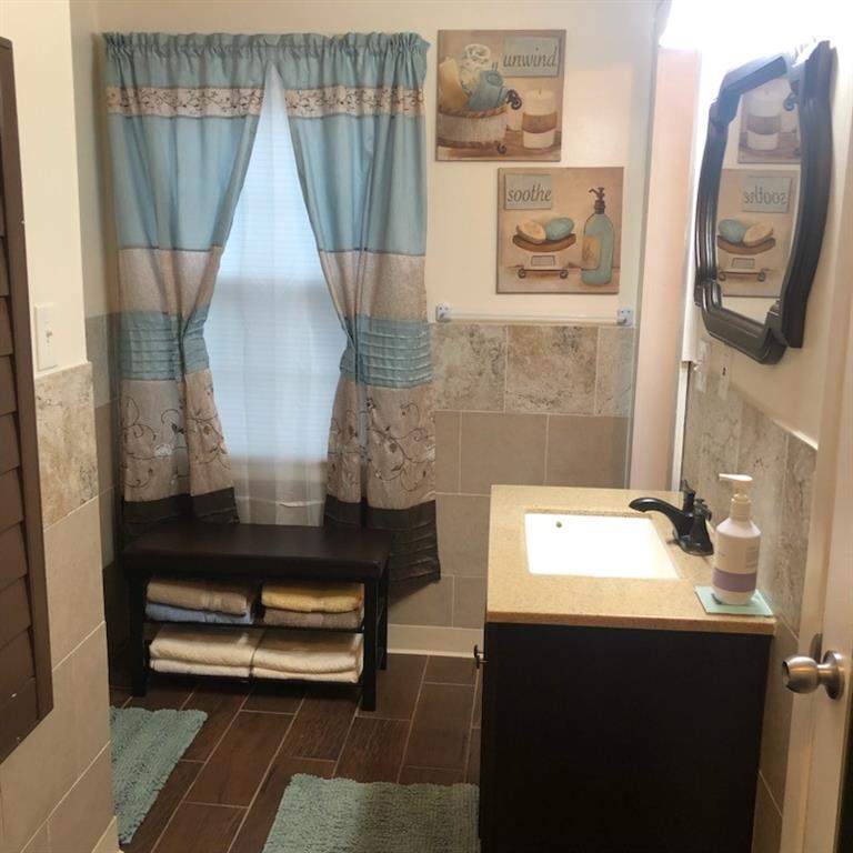 3960 Emerald N Drive Decatur, GA 30035 - Photo 5 of 8 a bathroom with a sink and a mirror