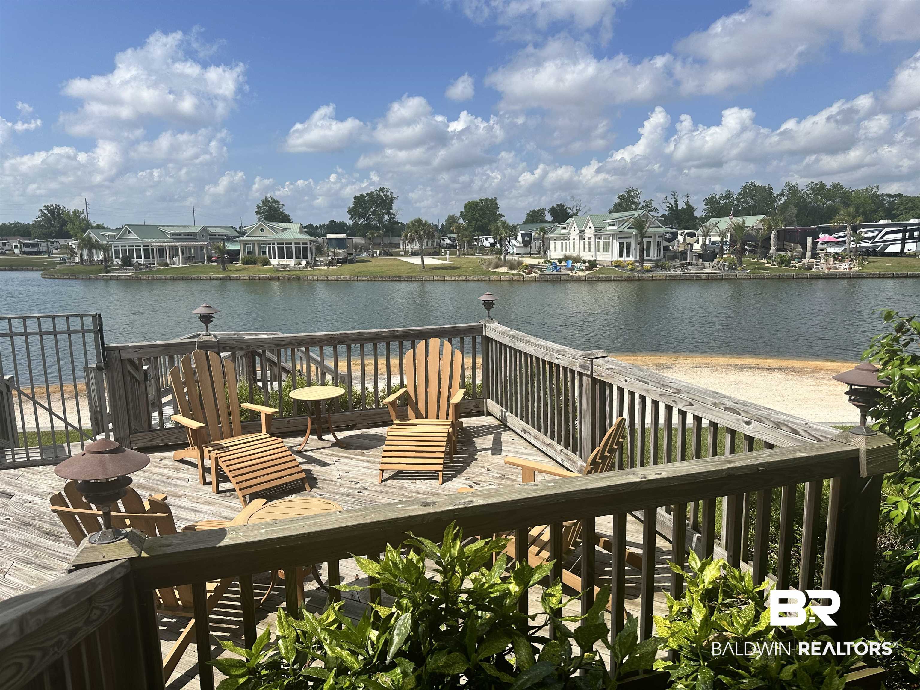 28238 Migratory Way Elberta, AL 36530 - Photo 38 of 58 Wooden terrace featuring a residential view and a water view
