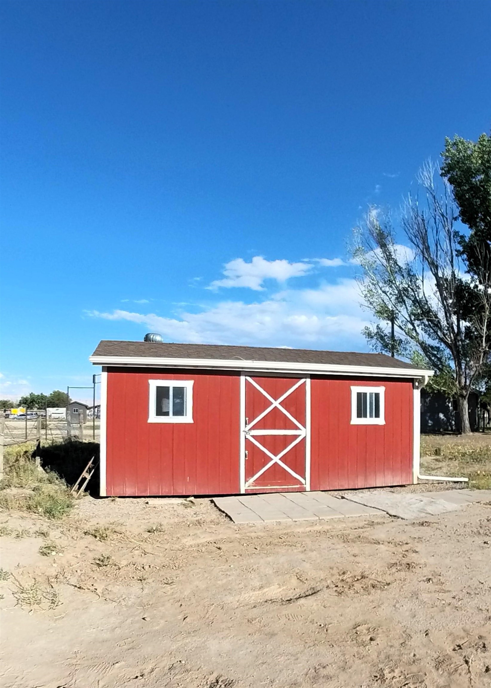2108 1/2 H Road Fruita, CO 81521 - Photo 12 of 40 a front view of a house with a yard