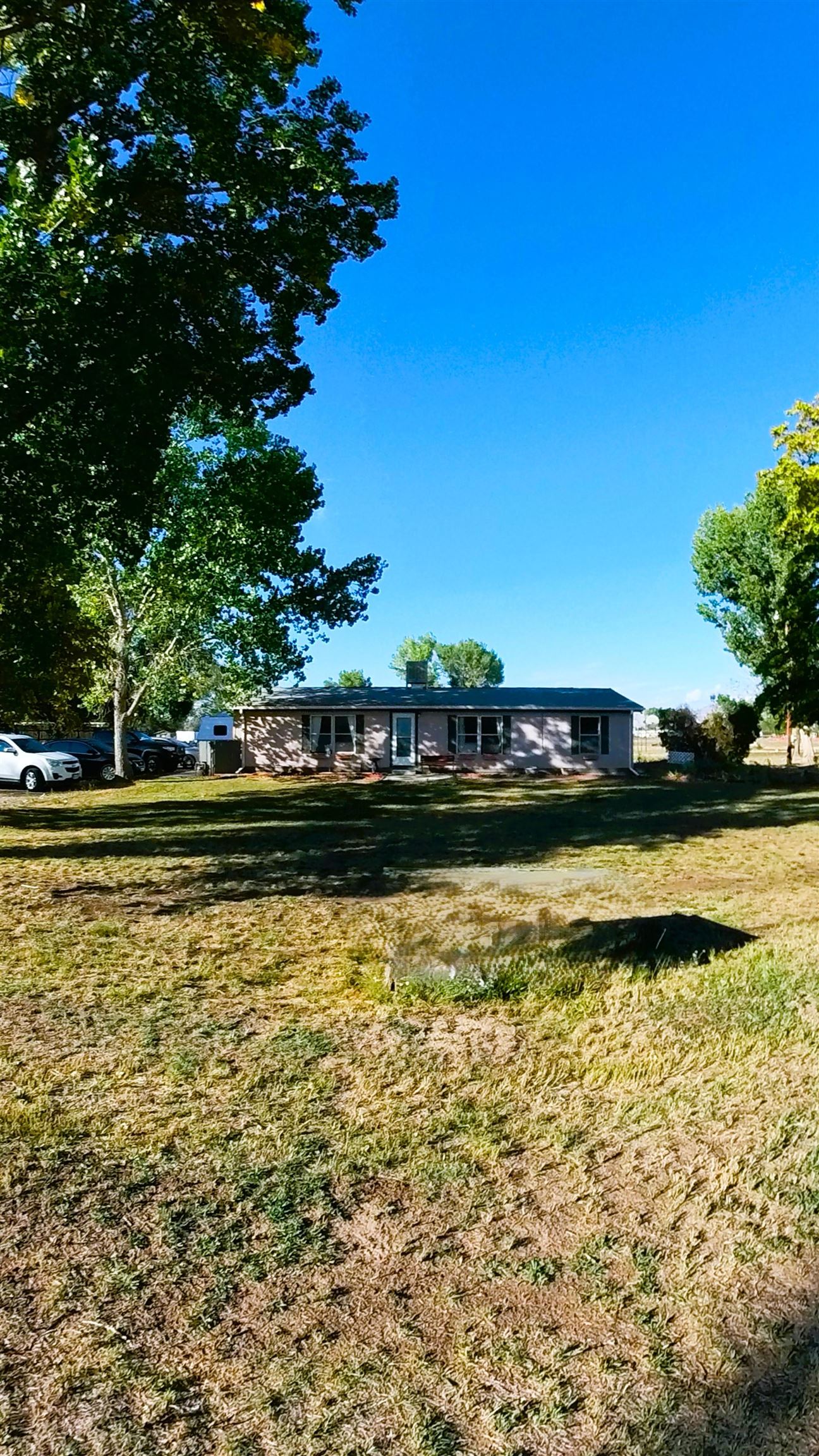 2108 1/2 H Road Fruita, CO 81521 - Photo 17 of 40 a view of swimming pool with outdoor seating
