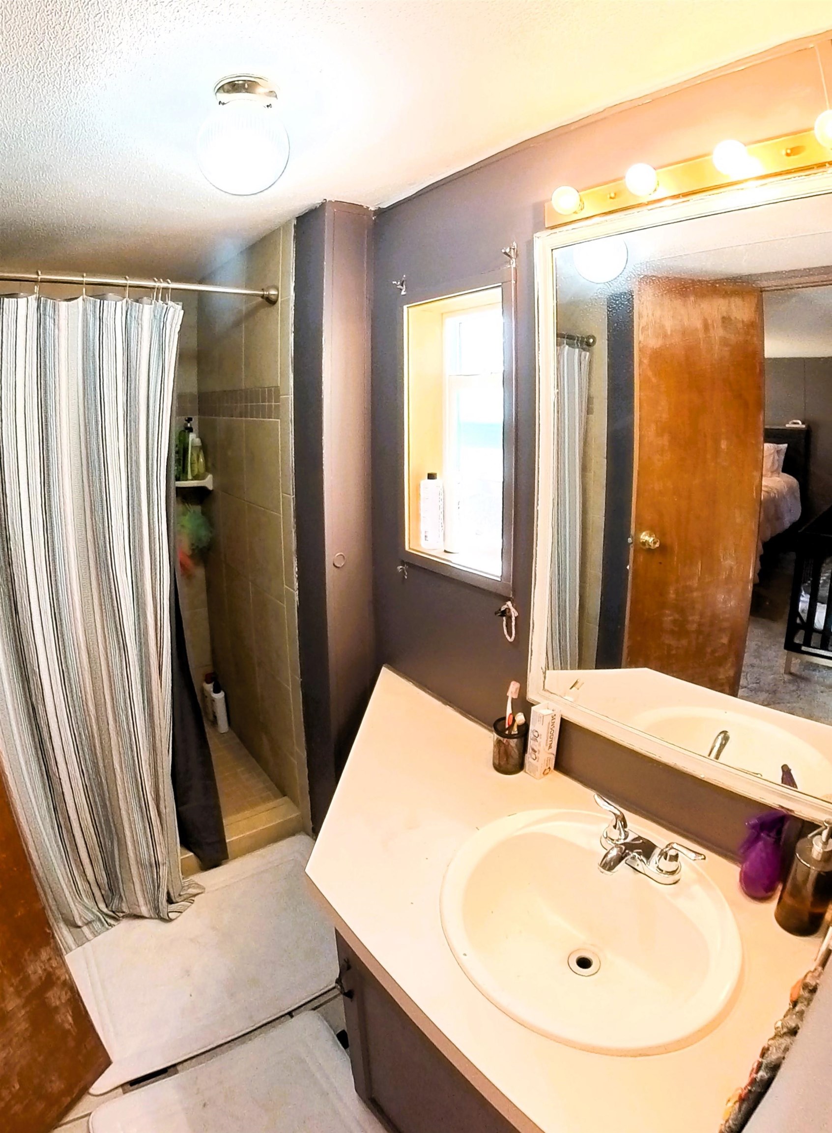 2108 1/2 H Road Fruita, CO 81521 - Photo 21 of 40 a bathroom with a tub sink and mirror