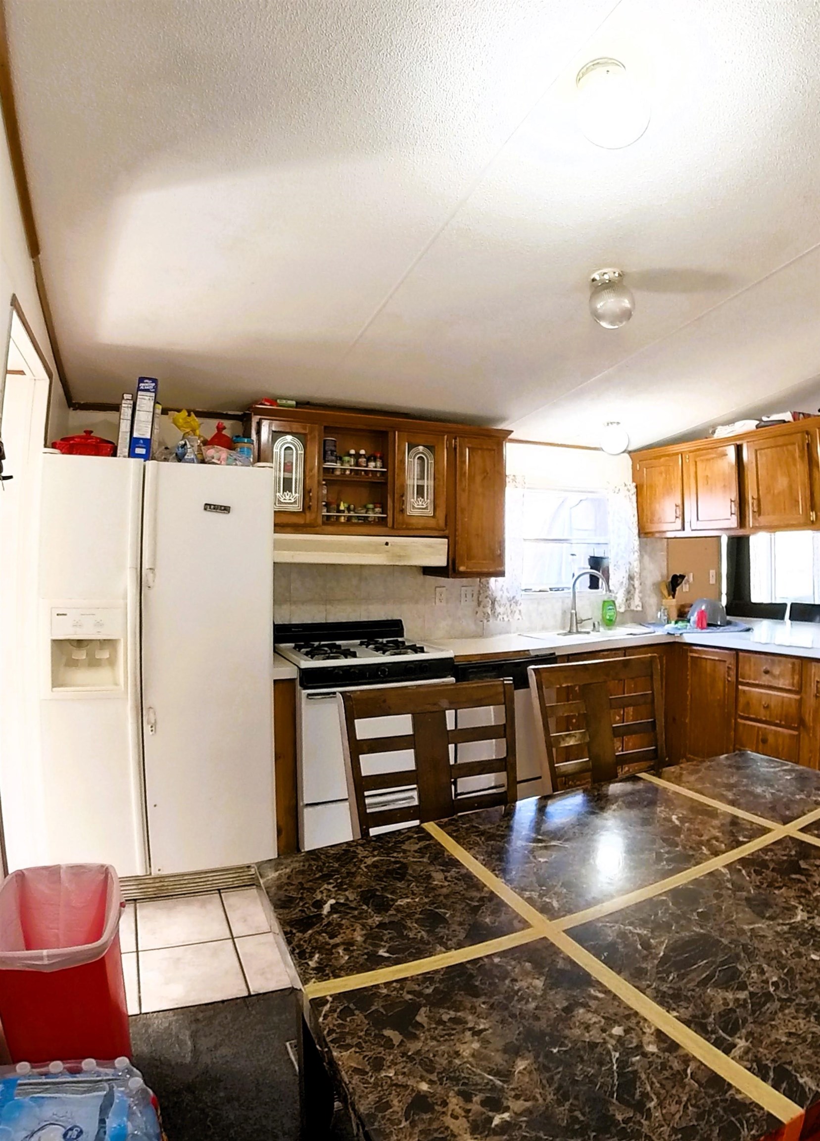 2108 1/2 H Road Fruita, CO 81521 - Photo 27 of 40 a kitchen with stainless steel appliances granite countertop a sink stove and refrigerator