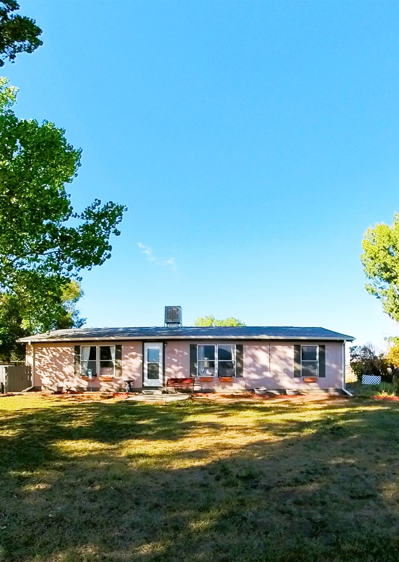 2108 1/2 H Road Fruita, CO 81521 - Photo 3 of 40 a view of a swimming pool with a yard
