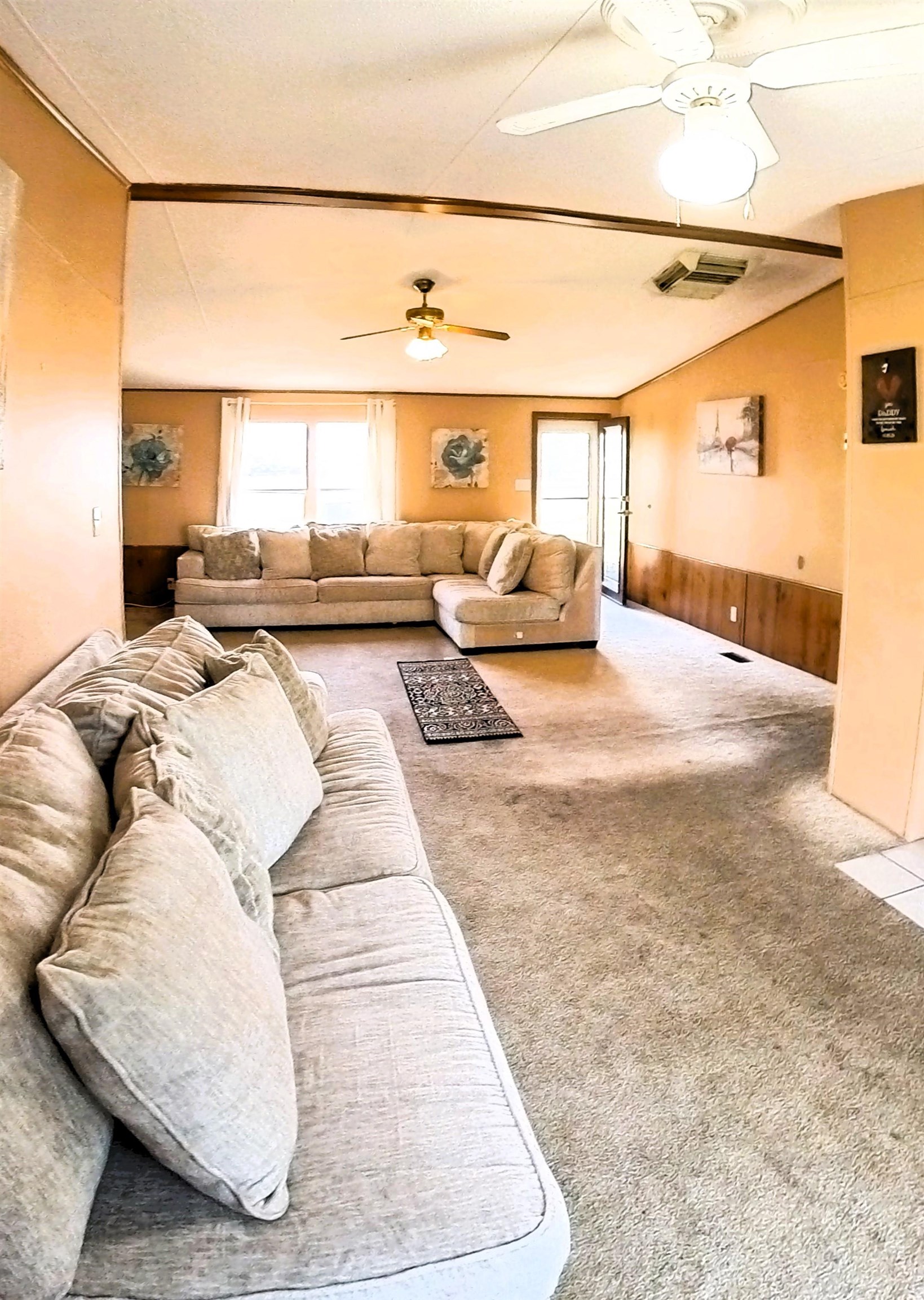 2108 1/2 H Road Fruita, CO 81521 - Photo 31 of 40 a living room with furniture and a large window