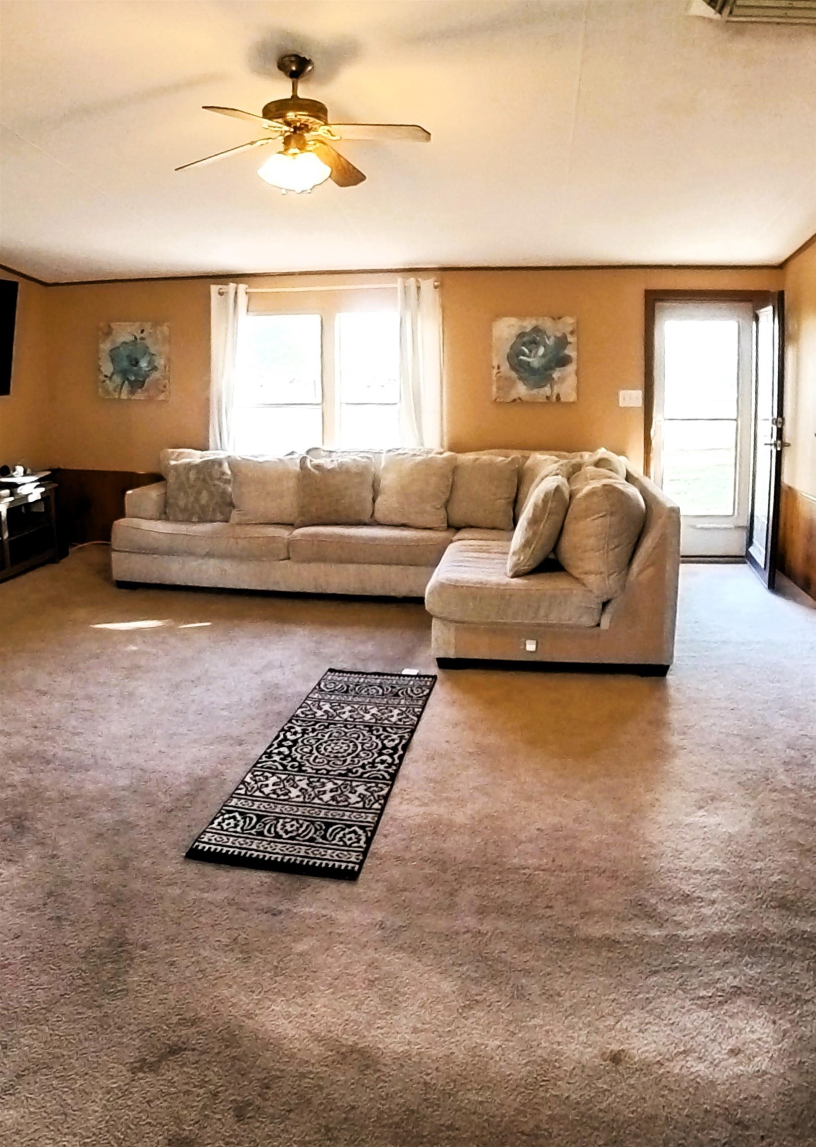 2108 1/2 H Road Fruita, CO 81521 - Photo 33 of 40 a living room with furniture and a large window