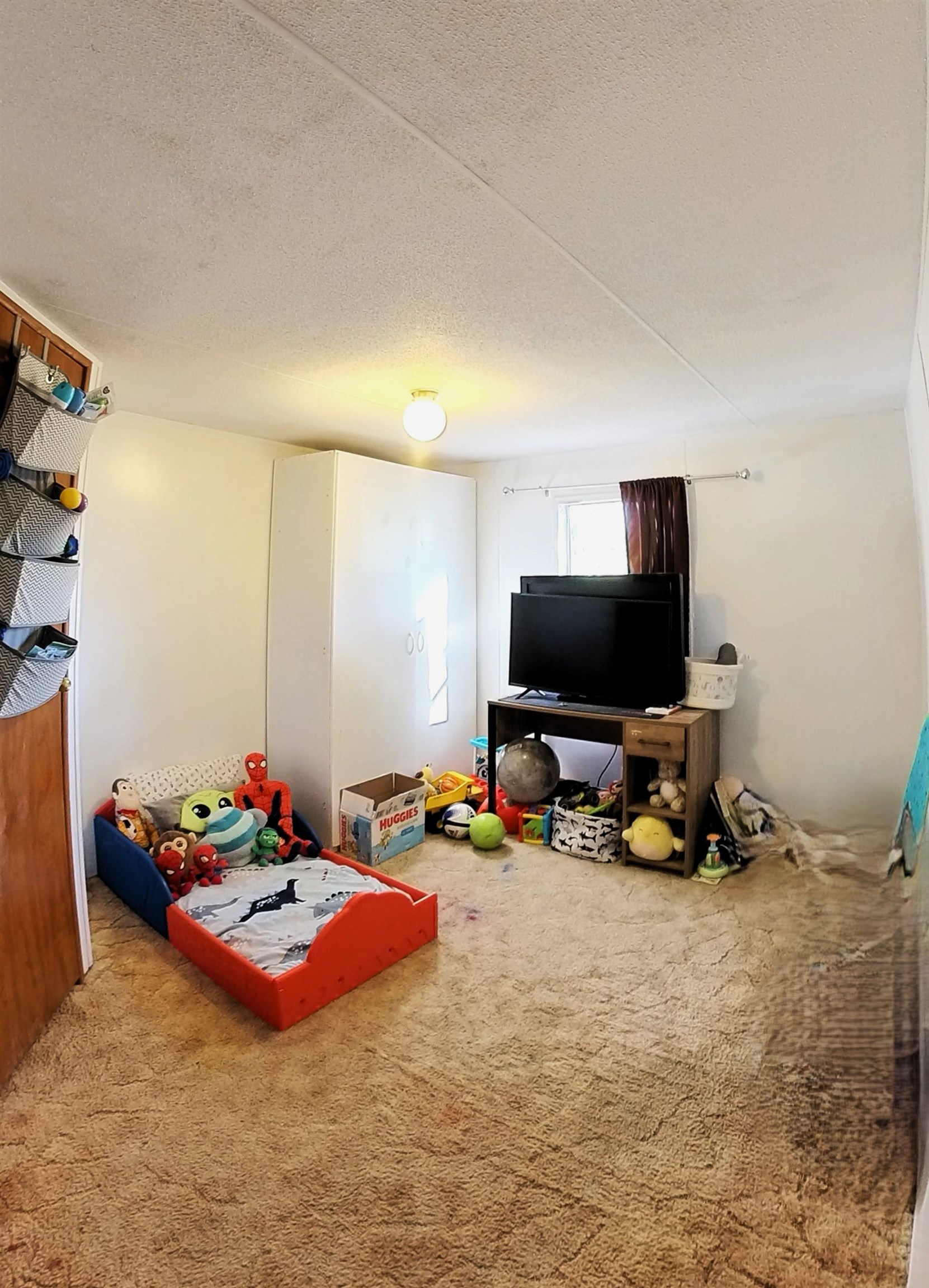 2108 1/2 H Road Fruita, CO 81521 - Photo 36 of 40 a bedroom with furniture and a flat screen tv