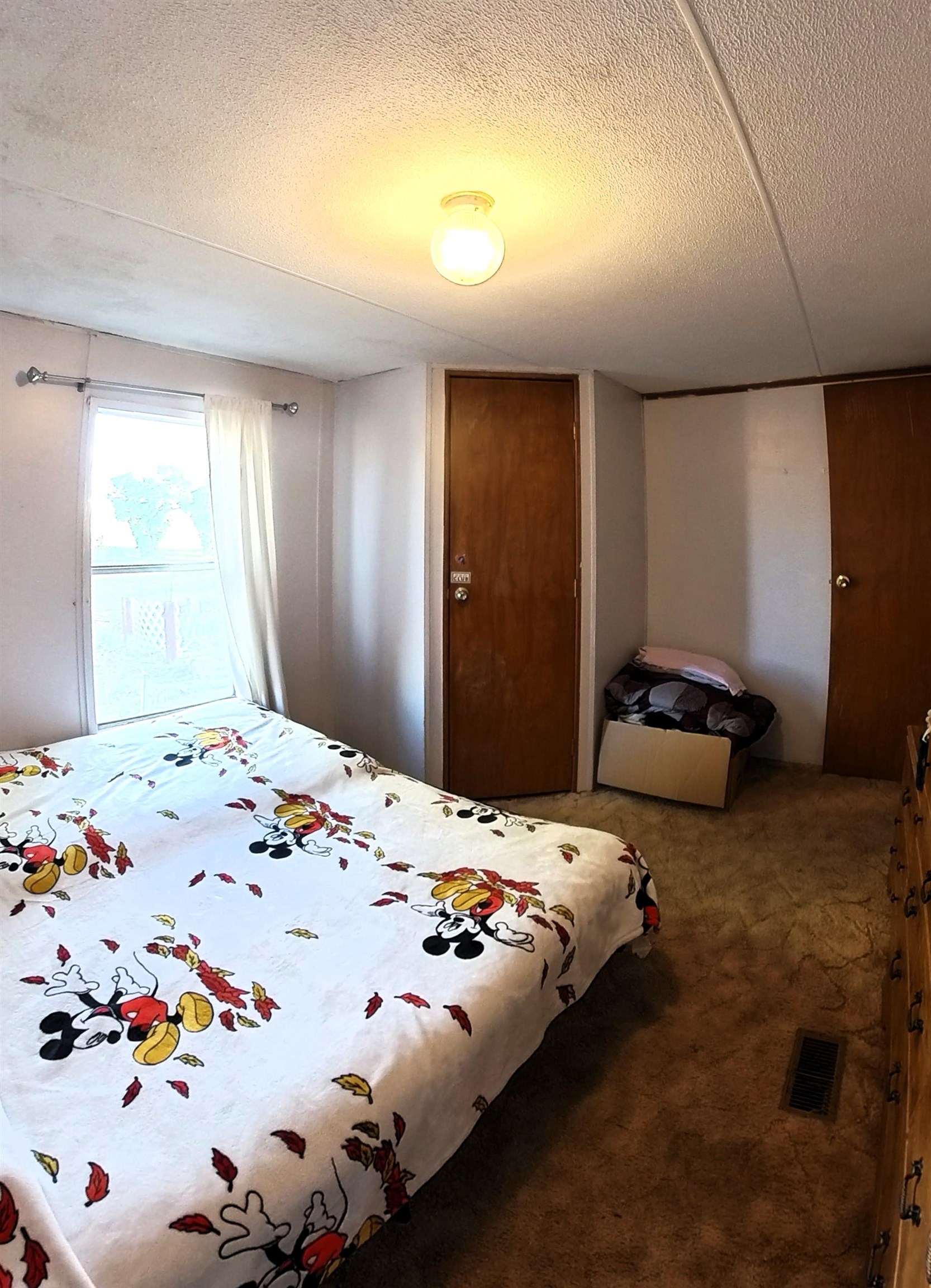 2108 1/2 H Road Fruita, CO 81521 - Photo 39 of 40 a bedroom with a bed and a window