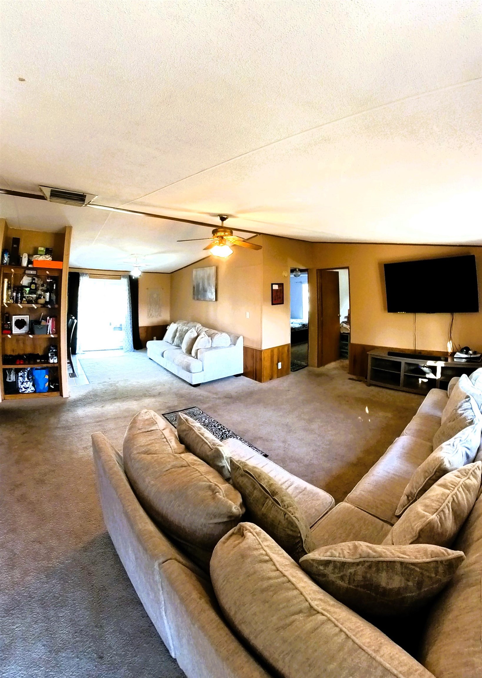 2108 1/2 H Road Fruita, CO 81521 - Photo 40 of 40 a living room with furniture and a flat screen tv