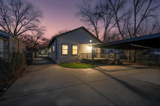 a view of a house with brick walls