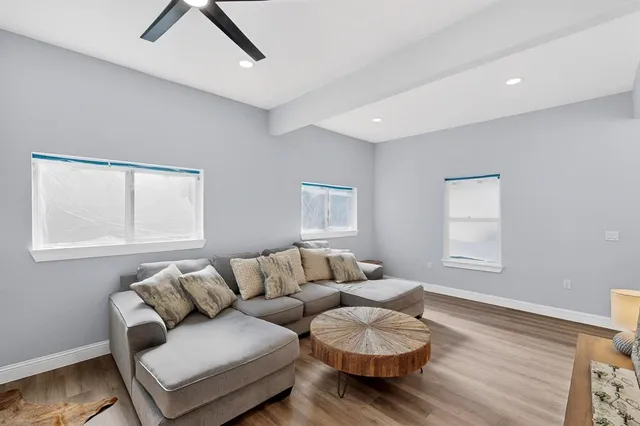 a living room with furniture and a window