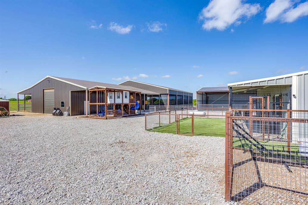 3678 County Road 3655 Bridgeport, TX 76426 - Photo 7 of 40 parking and view to show barn and covered arena