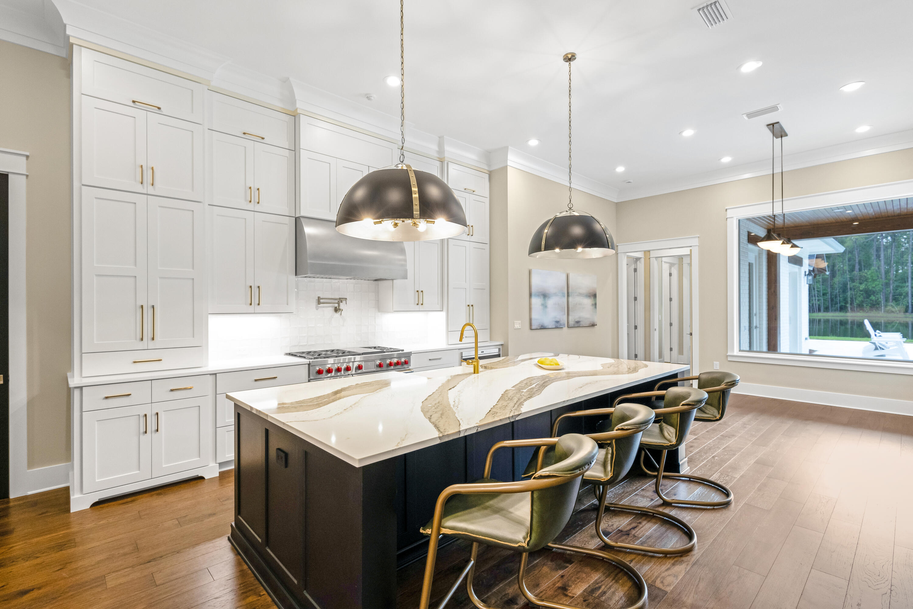 71 Clermont Cove Freeport, FL 32439 - Photo 20 of 73 a kitchen with a stove a refrigerator a sink and chairs