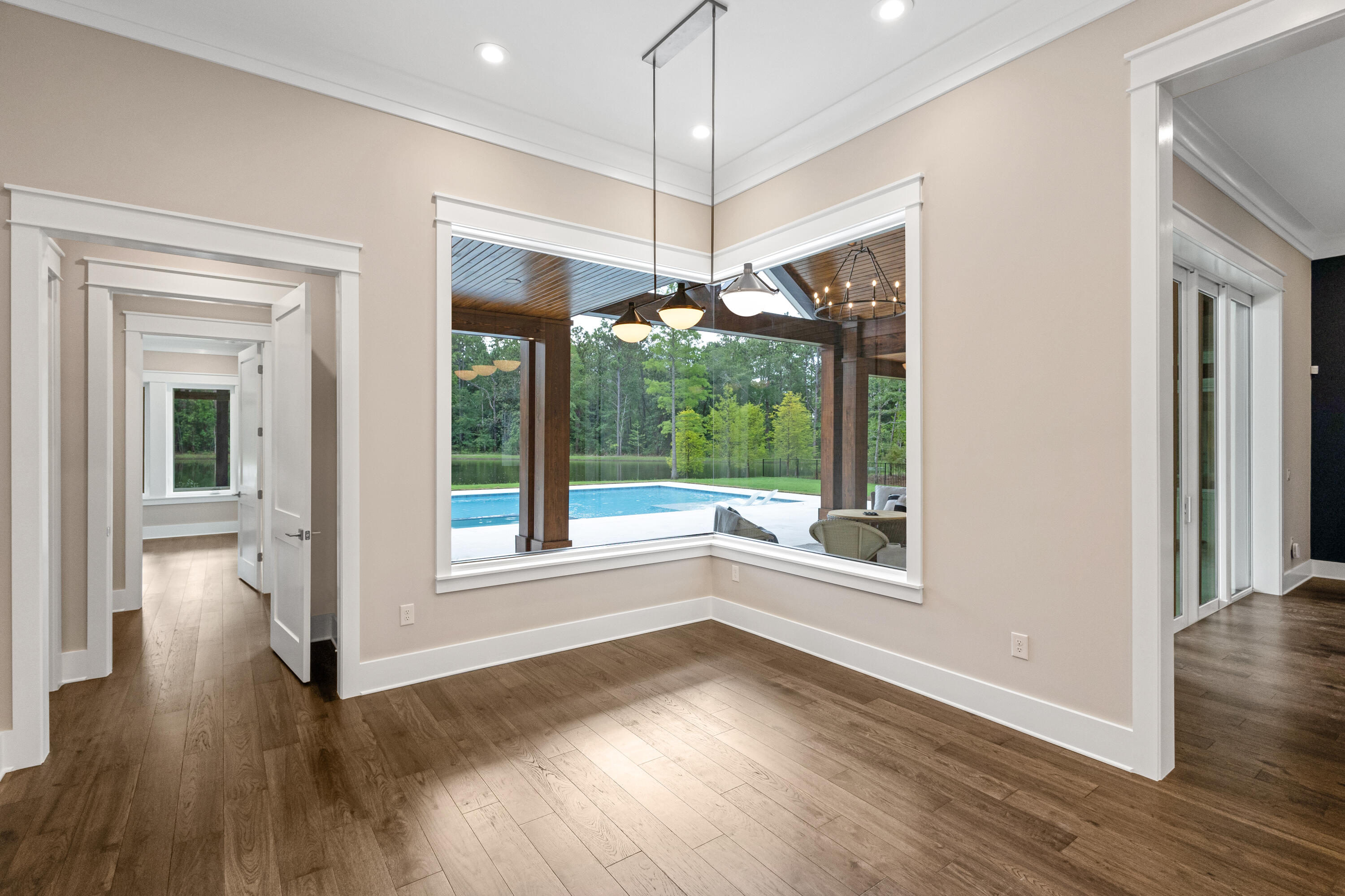 71 Clermont Cove Freeport, FL 32439 - Photo 21 of 73 a view of an empty room with wooden floor and a window