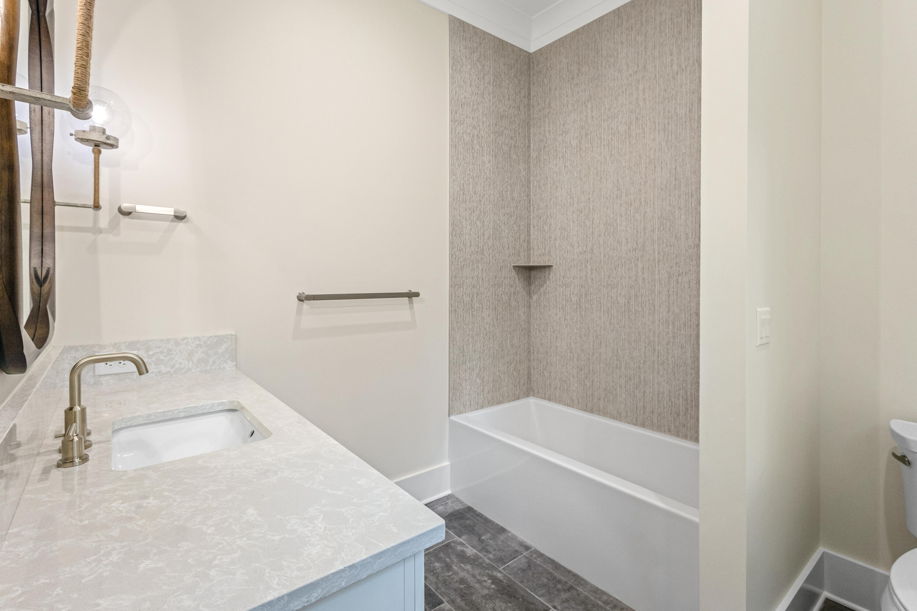 71 Clermont Cove Freeport, FL 32439 - Photo 28 of 73 a bathroom with a granite countertop sink a toilet and bathtub