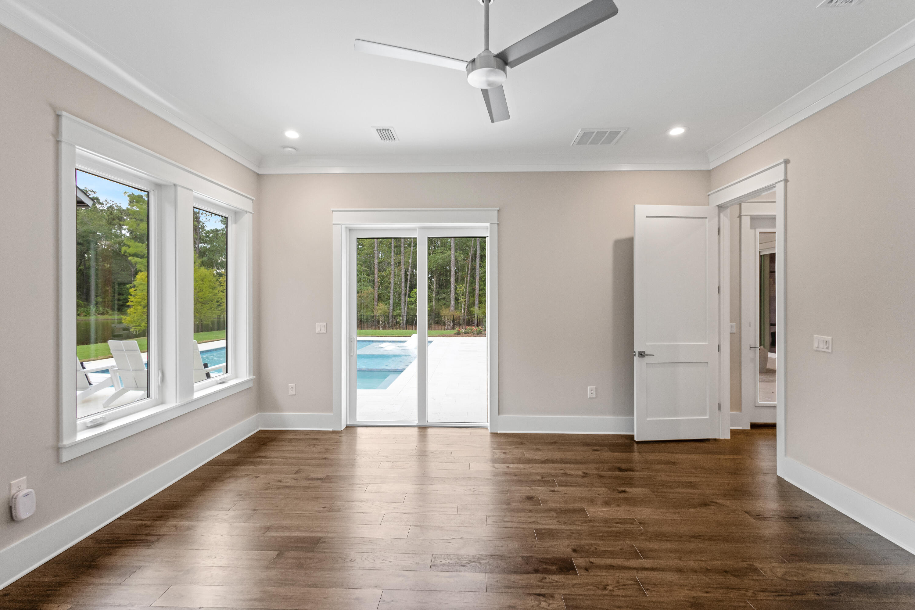 71 Clermont Cove Freeport, FL 32439 - Photo 32 of 73 a view of empty room with wooden floor and fan