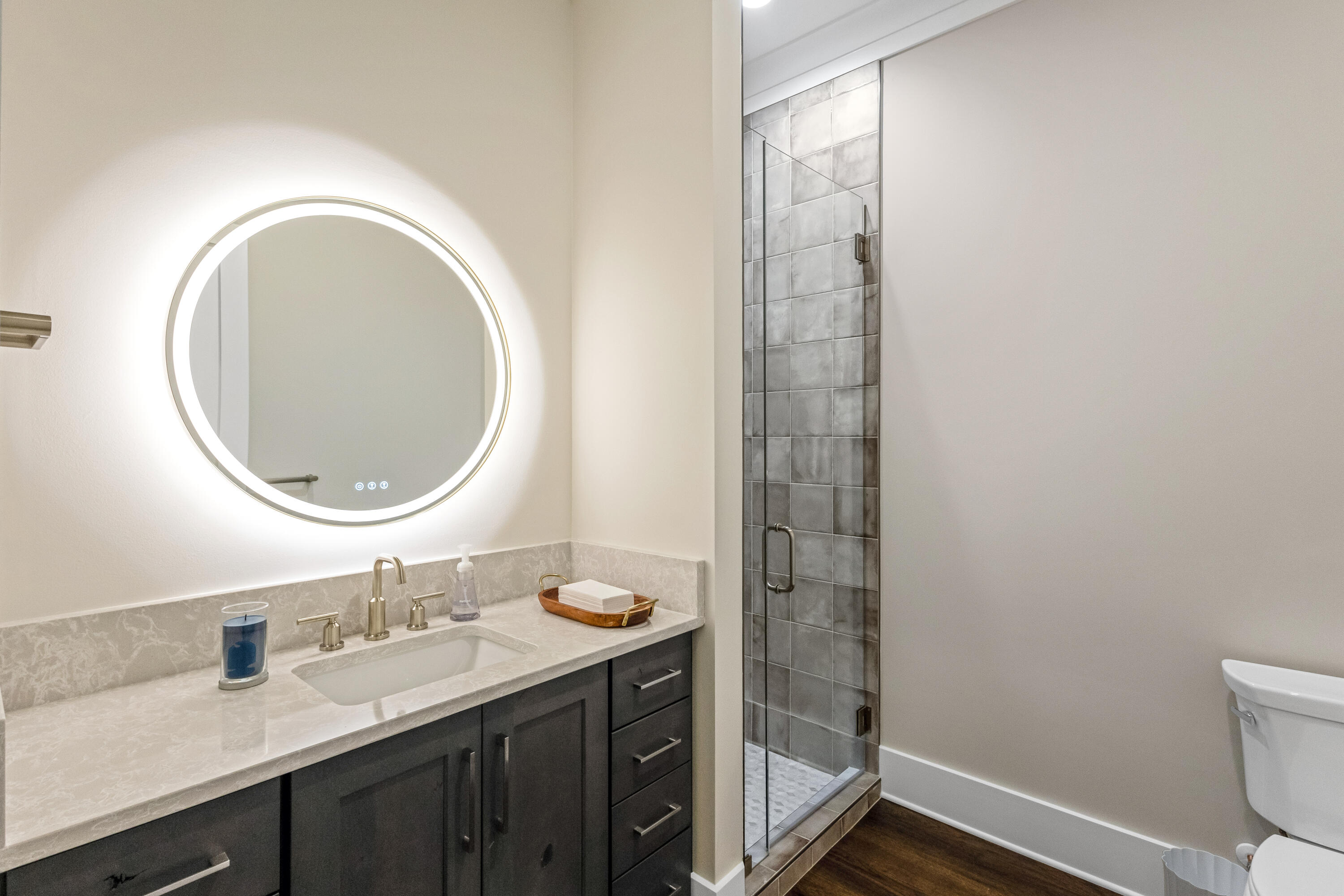 71 Clermont Cove Freeport, FL 32439 - Photo 33 of 73 a bathroom with a granite countertop sink mirror vanity and a toilet
