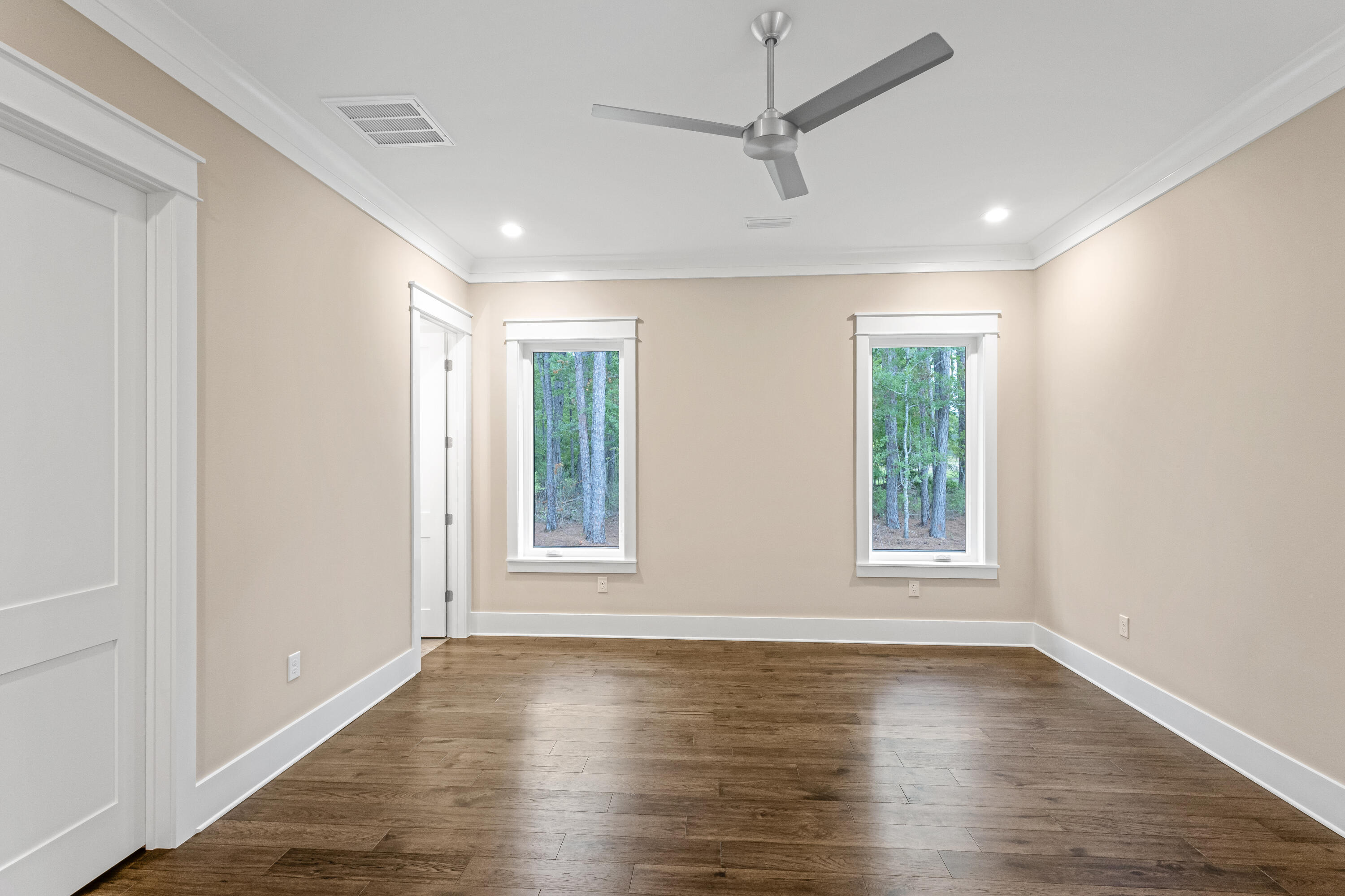 71 Clermont Cove Freeport, FL 32439 - Photo 37 of 73 a view of an empty room with wooden floor and a window
