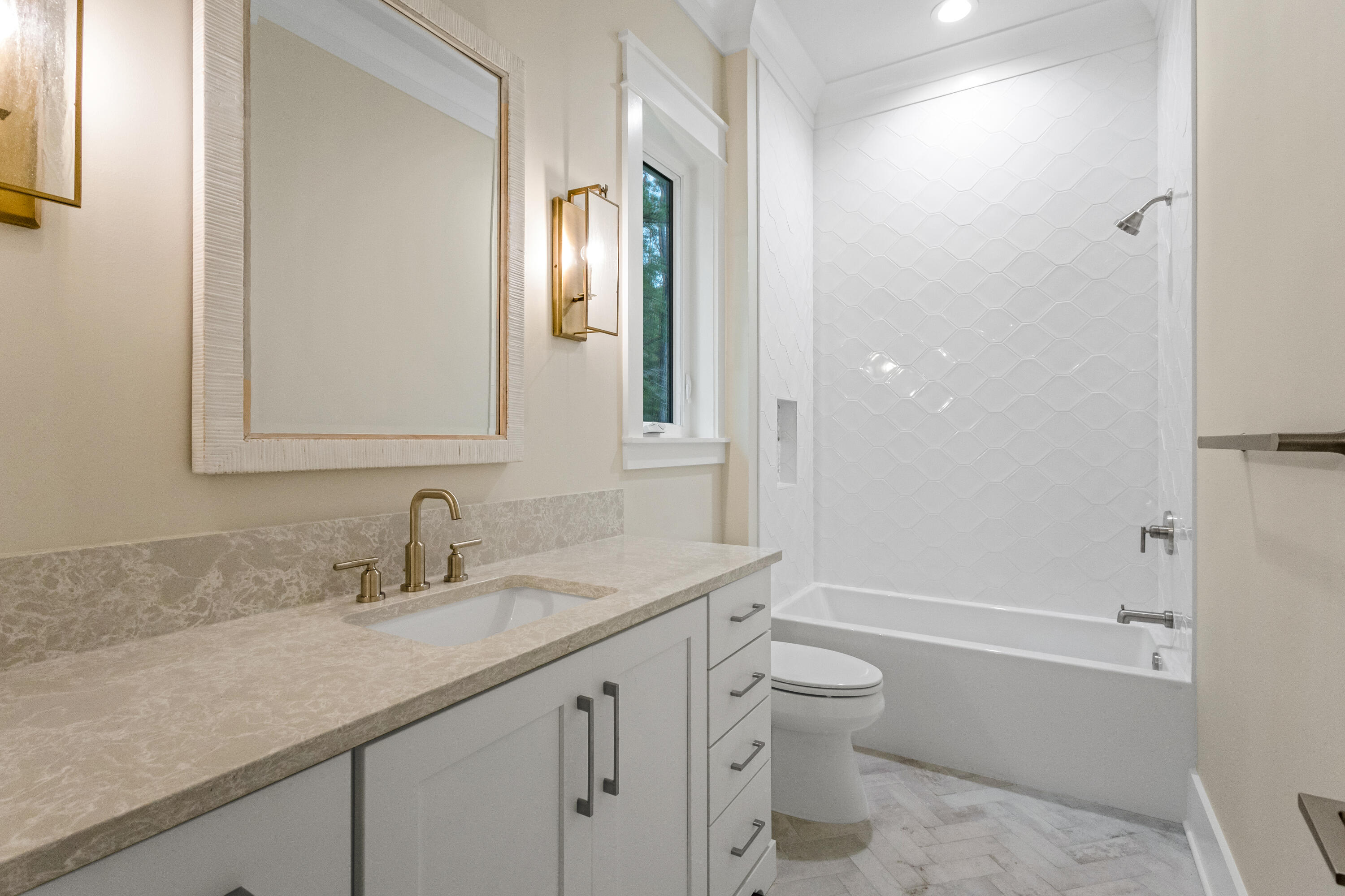71 Clermont Cove Freeport, FL 32439 - Photo 40 of 73 a bathroom with a granite countertop sink toilet and shower