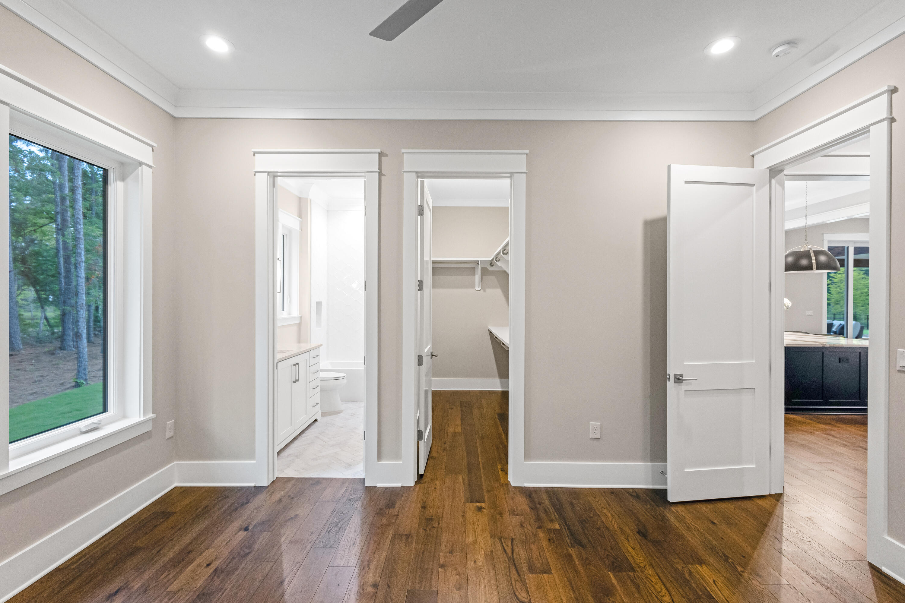 71 Clermont Cove Freeport, FL 32439 - Photo 41 of 73 a view of wooden floor in an empty room with a window