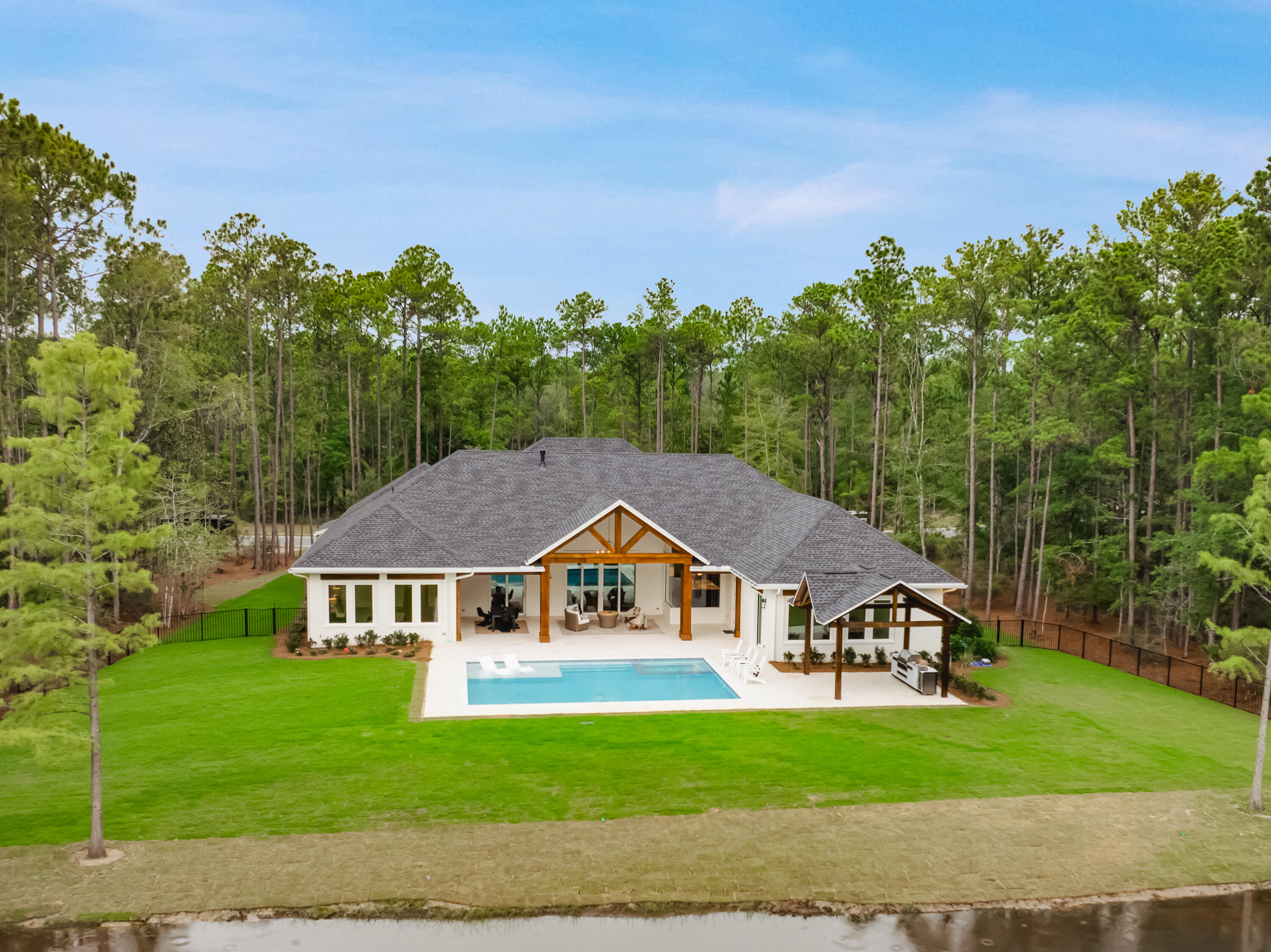 71 Clermont Cove Freeport, FL 32439 - Photo 45 of 73 a view of a big house with a big yard and large trees