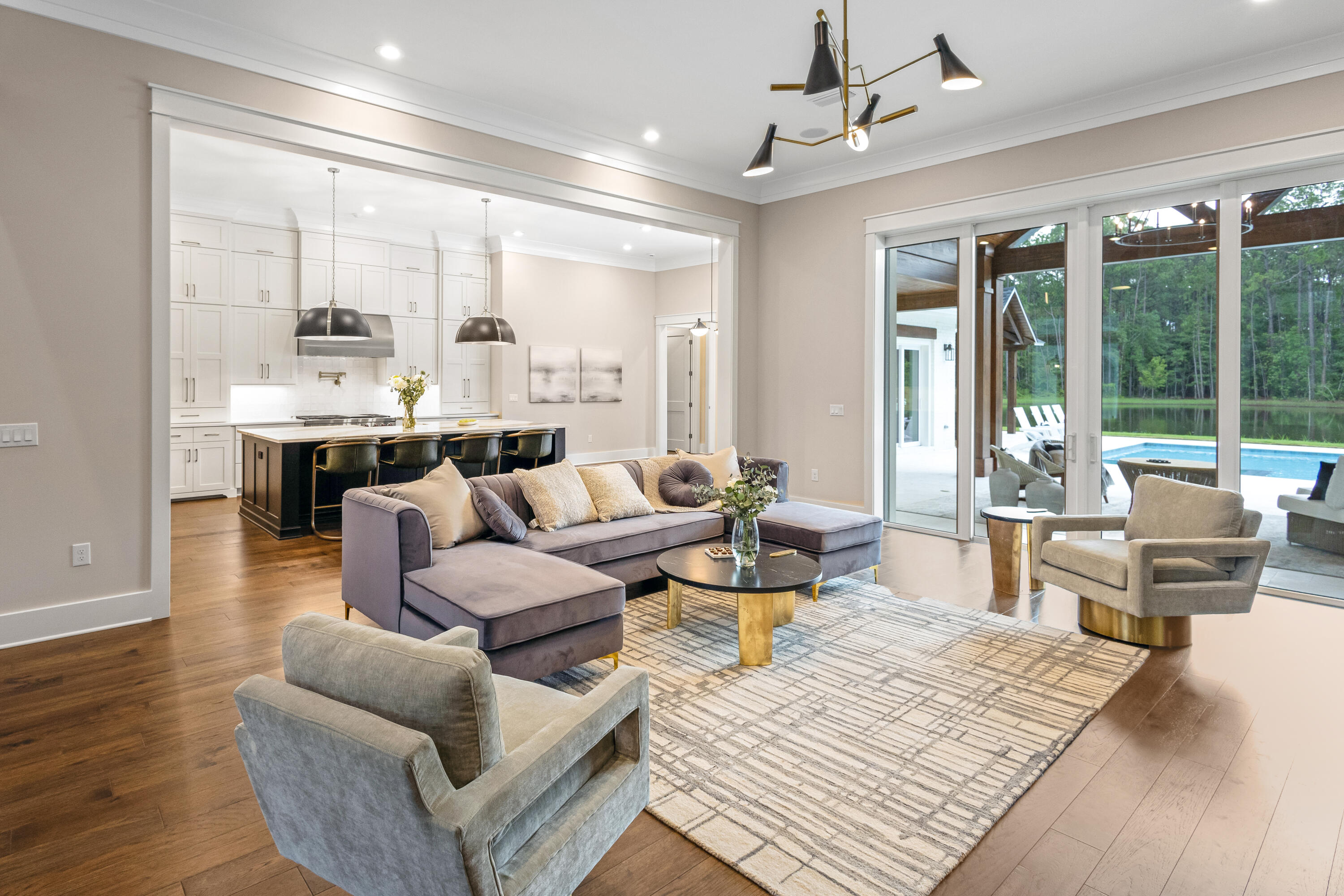 71 Clermont Cove Freeport, FL 32439 - Photo 7 of 73 a living room with furniture large window and wooden floor