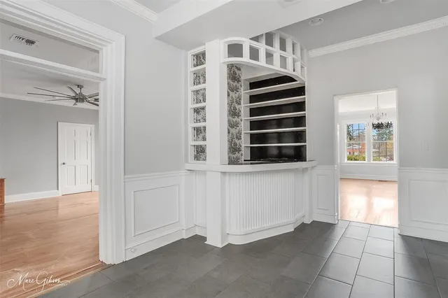 a view of an entryway with wooden floor and windows