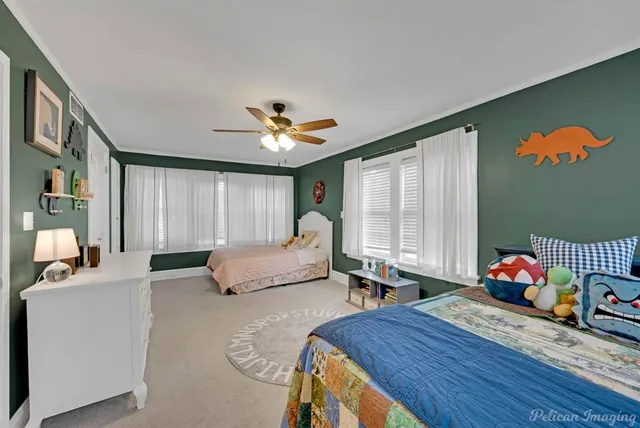 a bedroom with furniture and a window