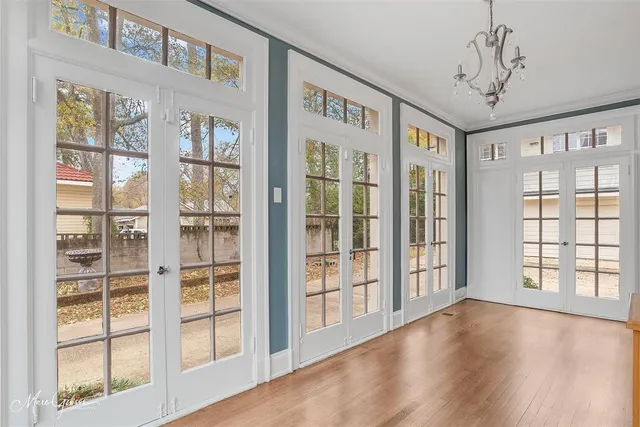 a view of an entryway with wooden floor