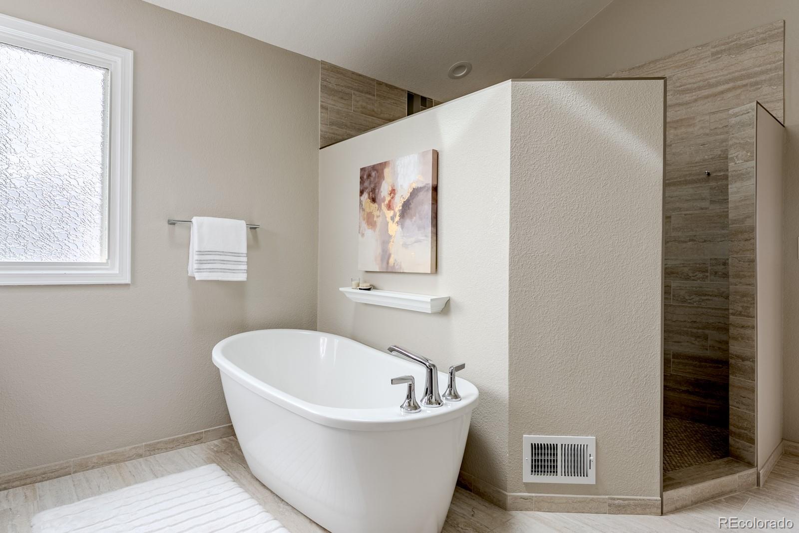 1914 Terrace Drive Highlands Ranch, CO 80126 - Photo 23 of 47 a white bath tub sitting next to a white sink