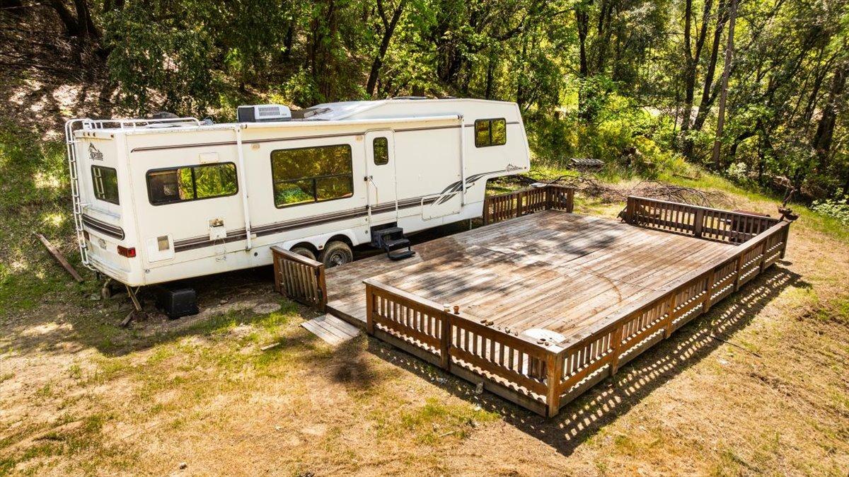 a view of a house with pool and chairs