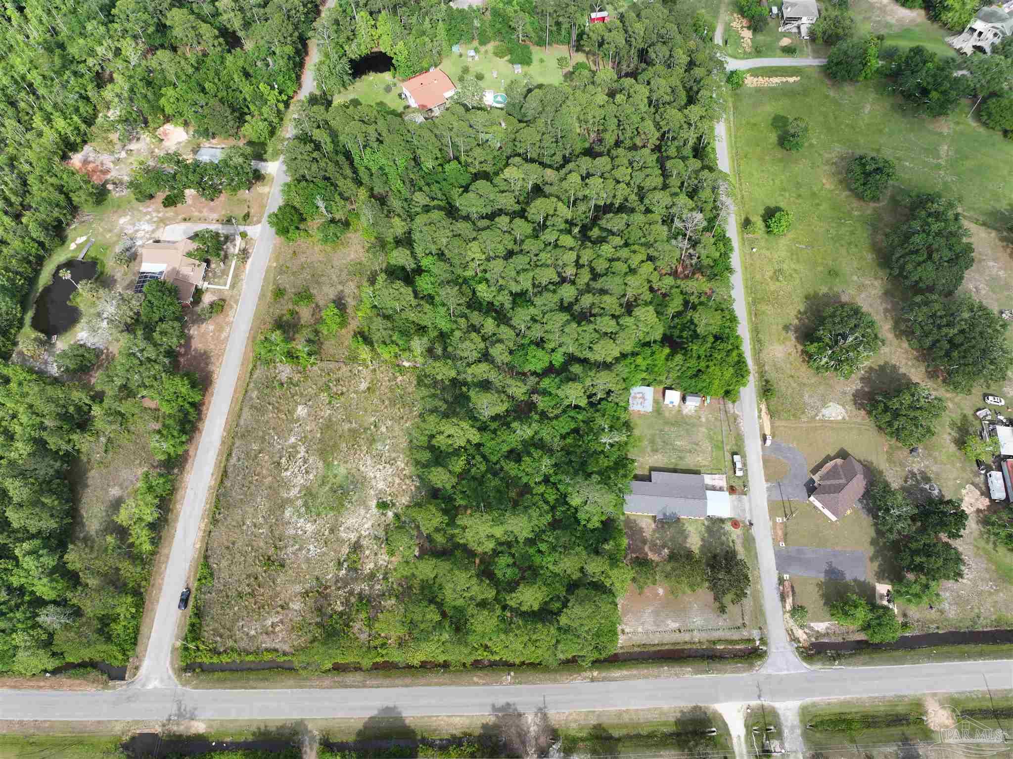 Robinson Point Road Milton, FL 32583 - Photo 8 of 11 an aerial view of a residential houses with yard