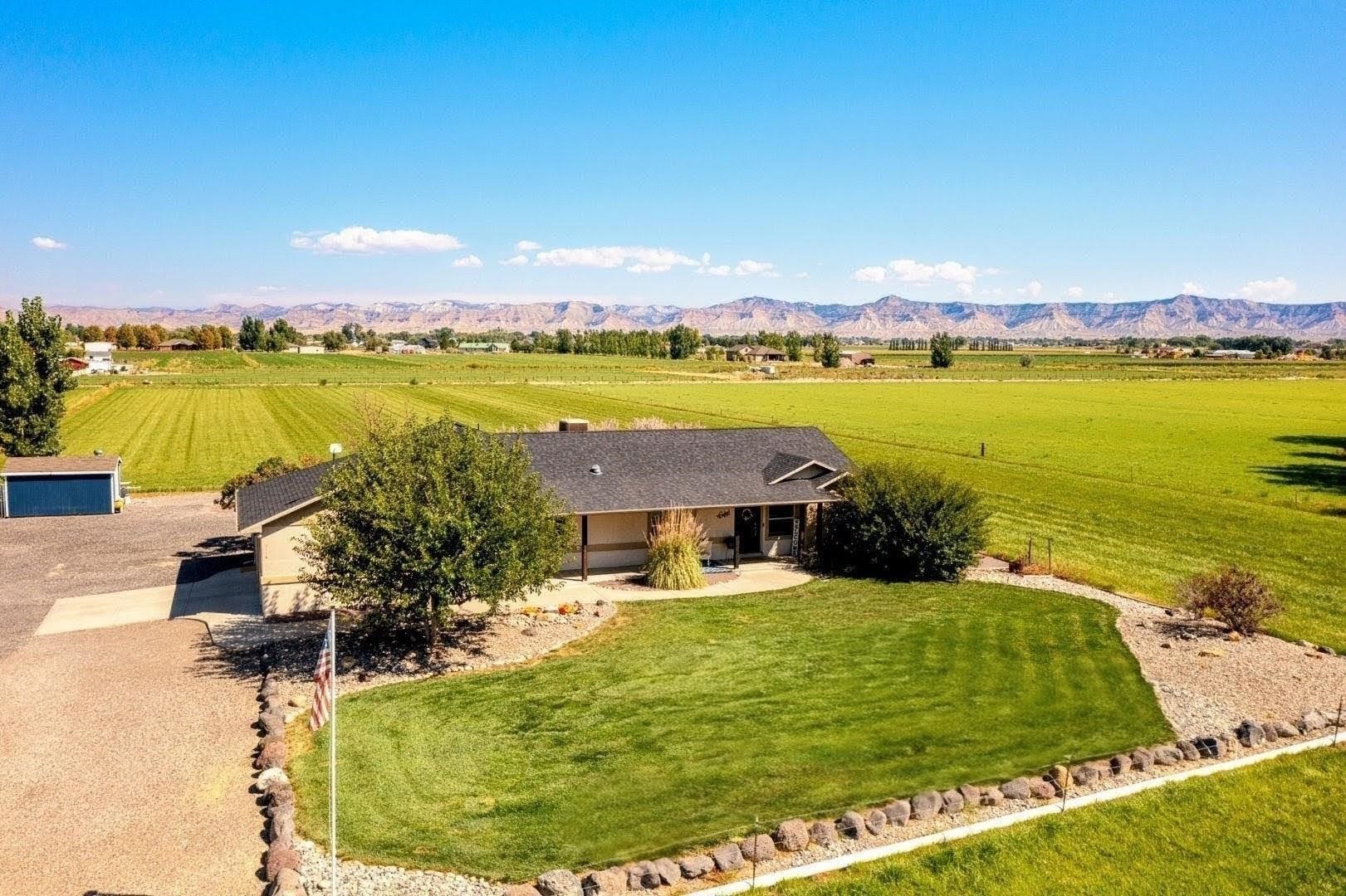 2116 I Road Grand Junction, CO 81505 - Photo 2 of 37 a view of a lake with houses in the back