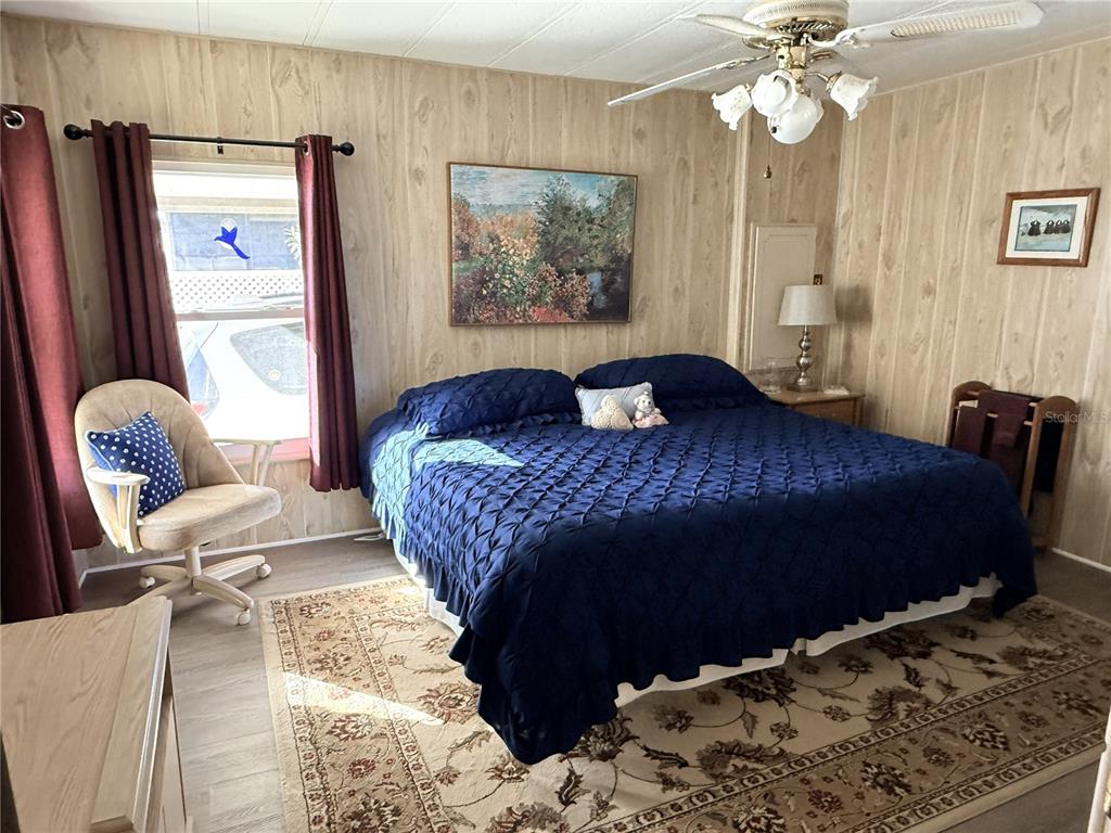 4418 Brave Lane St. Cloud, FL 34772 - Photo 17 of 29 a bedroom with a bed couch and window