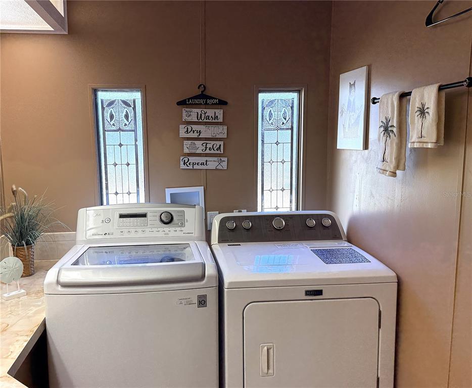 4418 Brave Lane St. Cloud, FL 34772 - Photo 20 of 29 a utility room with dryer and washer