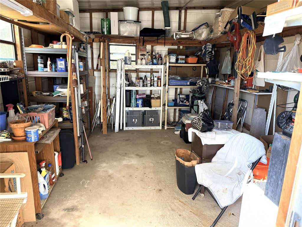 4418 Brave Lane St. Cloud, FL 34772 - Photo 29 of 29 a kitchen with a lot of stuff and cabinets