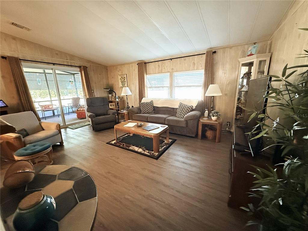 4418 Brave Lane St. Cloud, FL 34772 - Photo 7 of 29 a living room with furniture and a large window