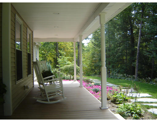 53 Two Ponds Road Belchertown, MA 01007 - Photo 18 of 19 a view of a porch with chairs and backyard
