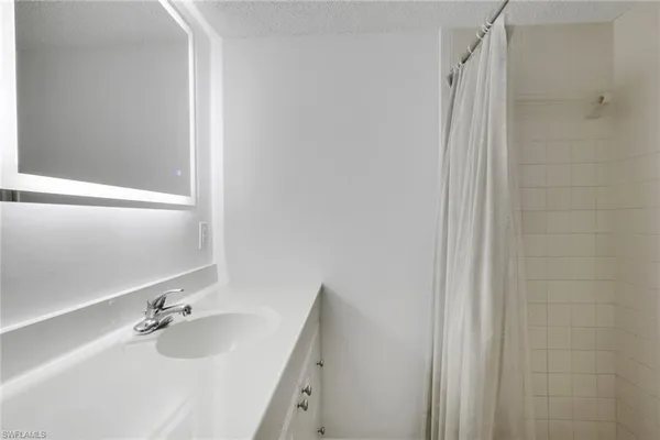 a bathroom with a tub and a sink