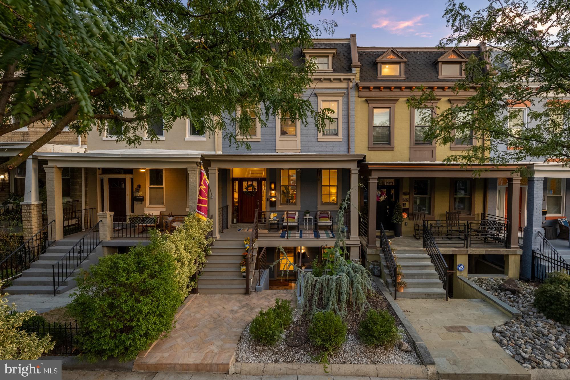 54 W Street Northwest Washington, DC 20001 - Photo 2 of 68 Charming row homes basking in golden light.