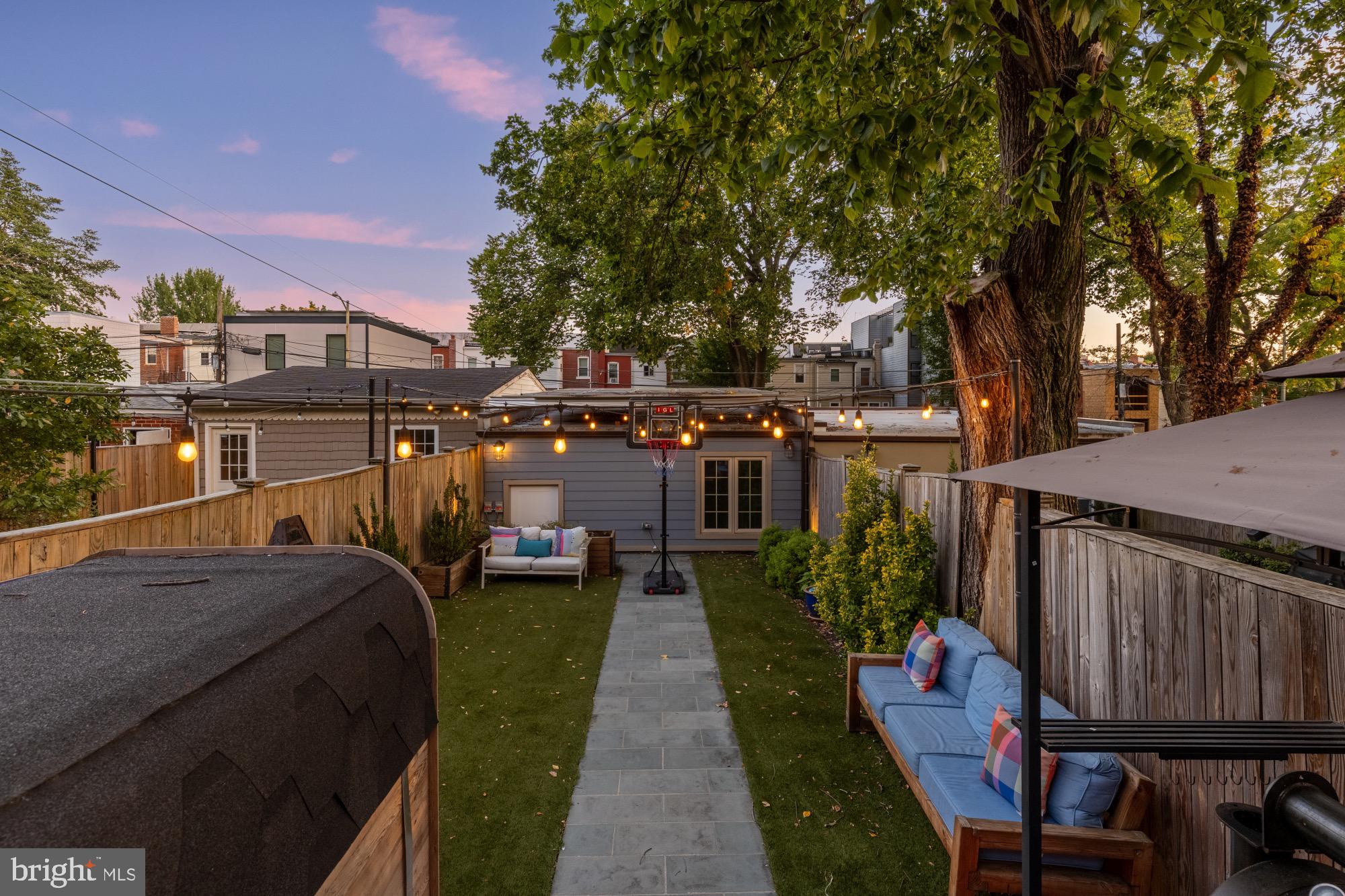 54 W Street Northwest Washington, DC 20001 - Photo 52 of 68 Charming backyard oasis at twilight.