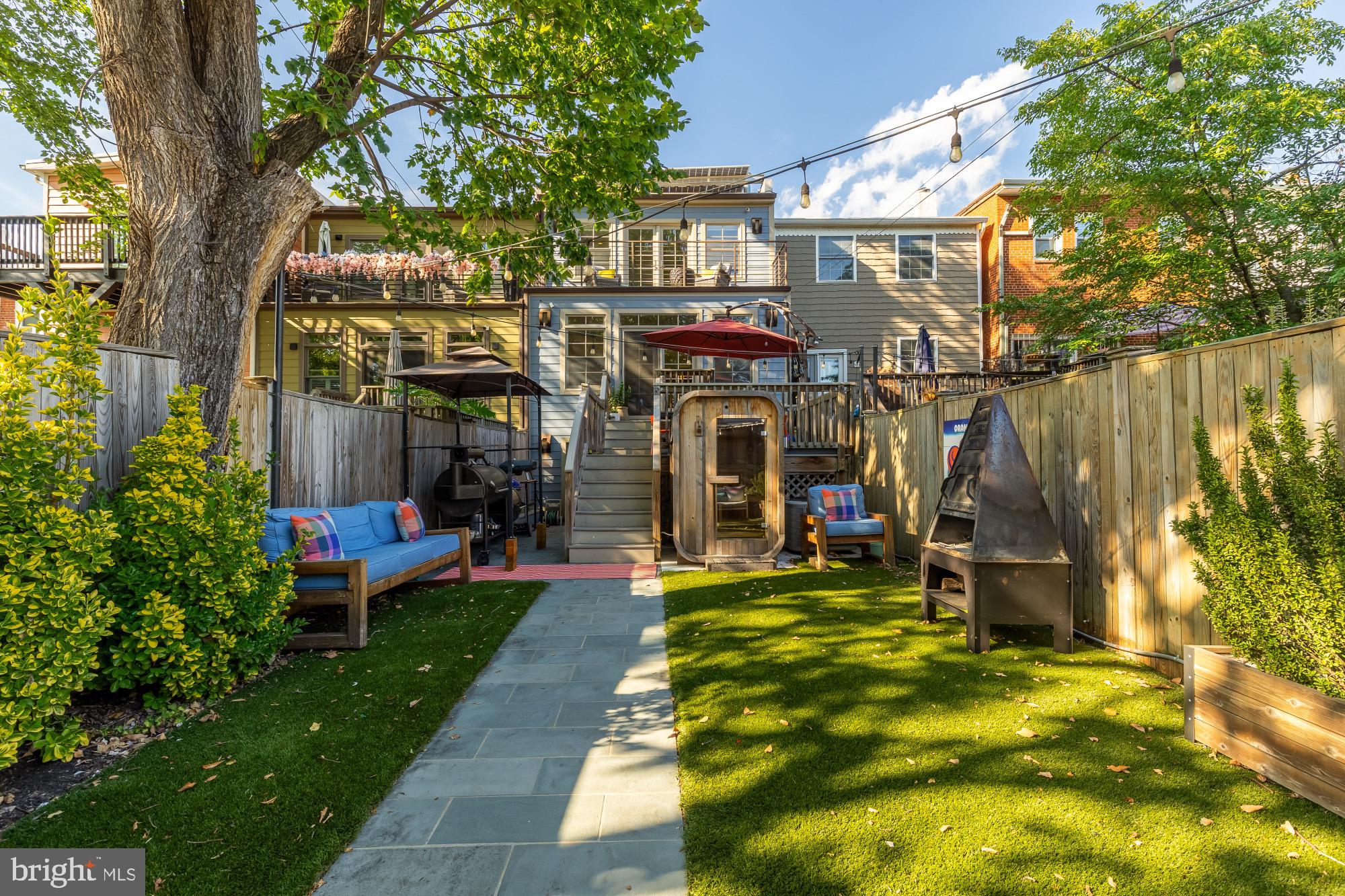 54 W Street Northwest Washington, DC 20001 - Photo 53 of 68 Charming backyard oasis with lush greenery.